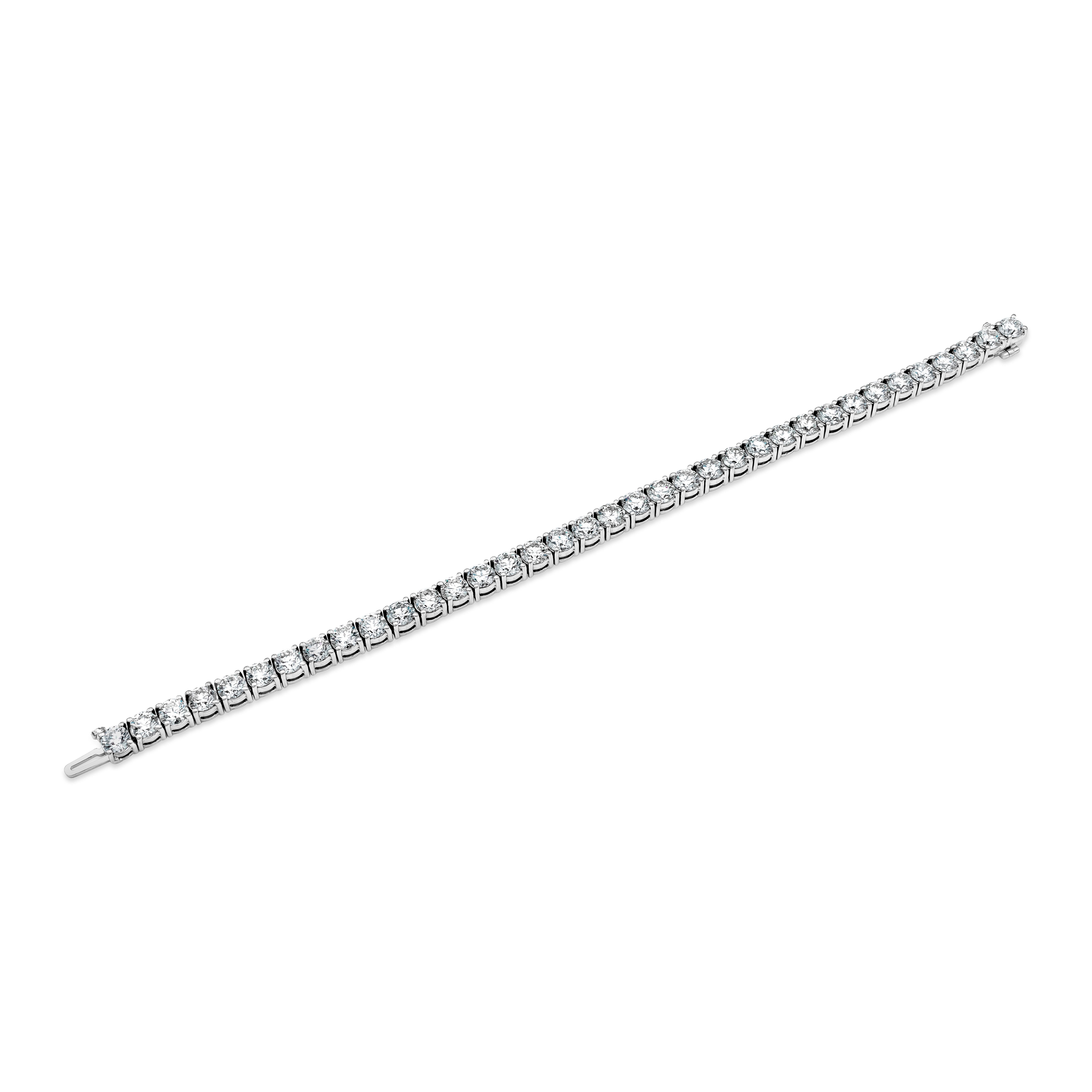 This timeless diamond tennis bracelet showcases 15.12 carats total round diamonds mounted in a classic four prong setting. Made in 14 karat white gold. 

Style available in different price ranges. Prices are based on diamond size, and specification.