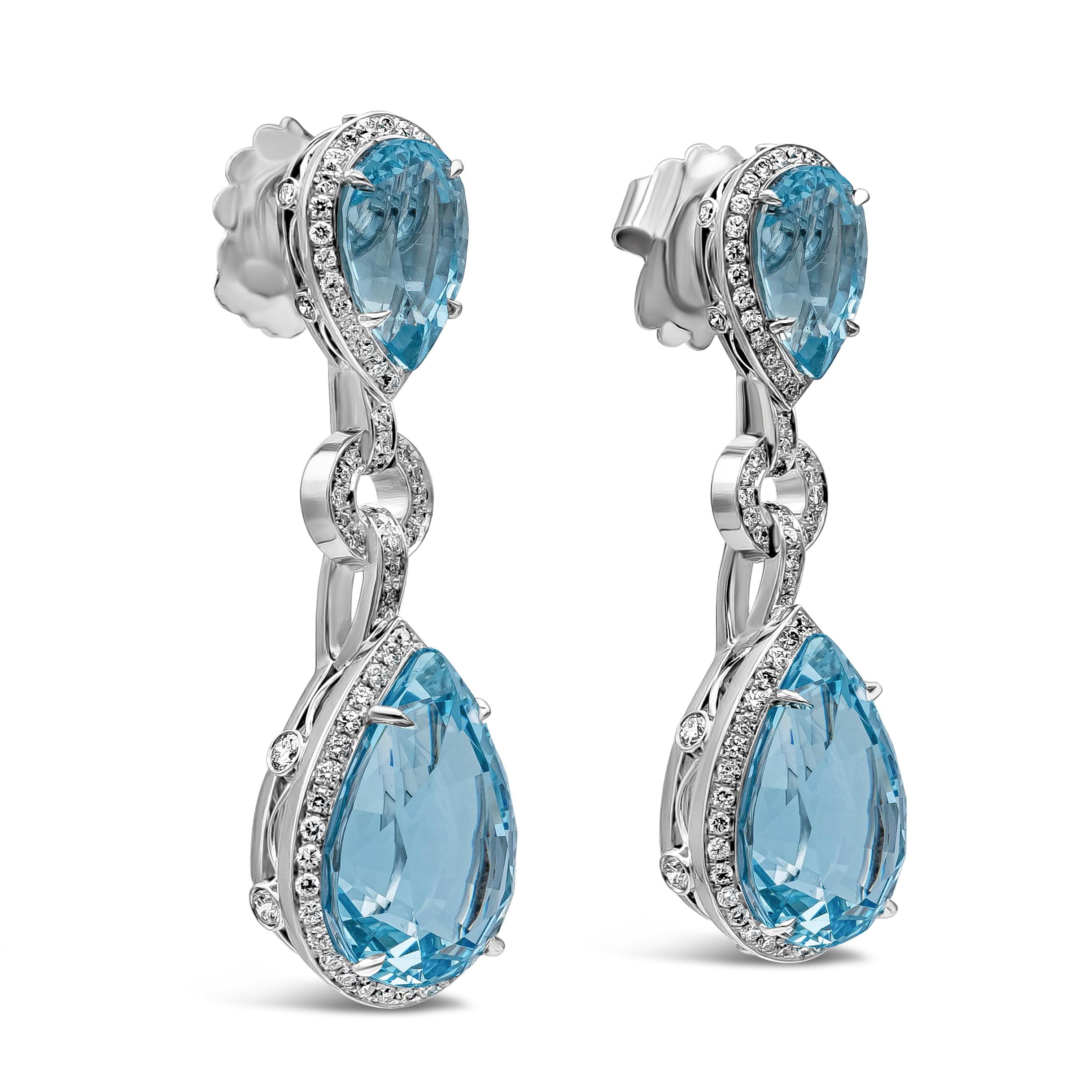 A beautiful pair of dangle earrings showcasing pear shape aquamarines weighing 15.79 carats total, surrounded by a row of round brilliant diamonds weighing 0.91 carats total. Made with 18K White Gold.

Roman Malakov is a custom house, specializing