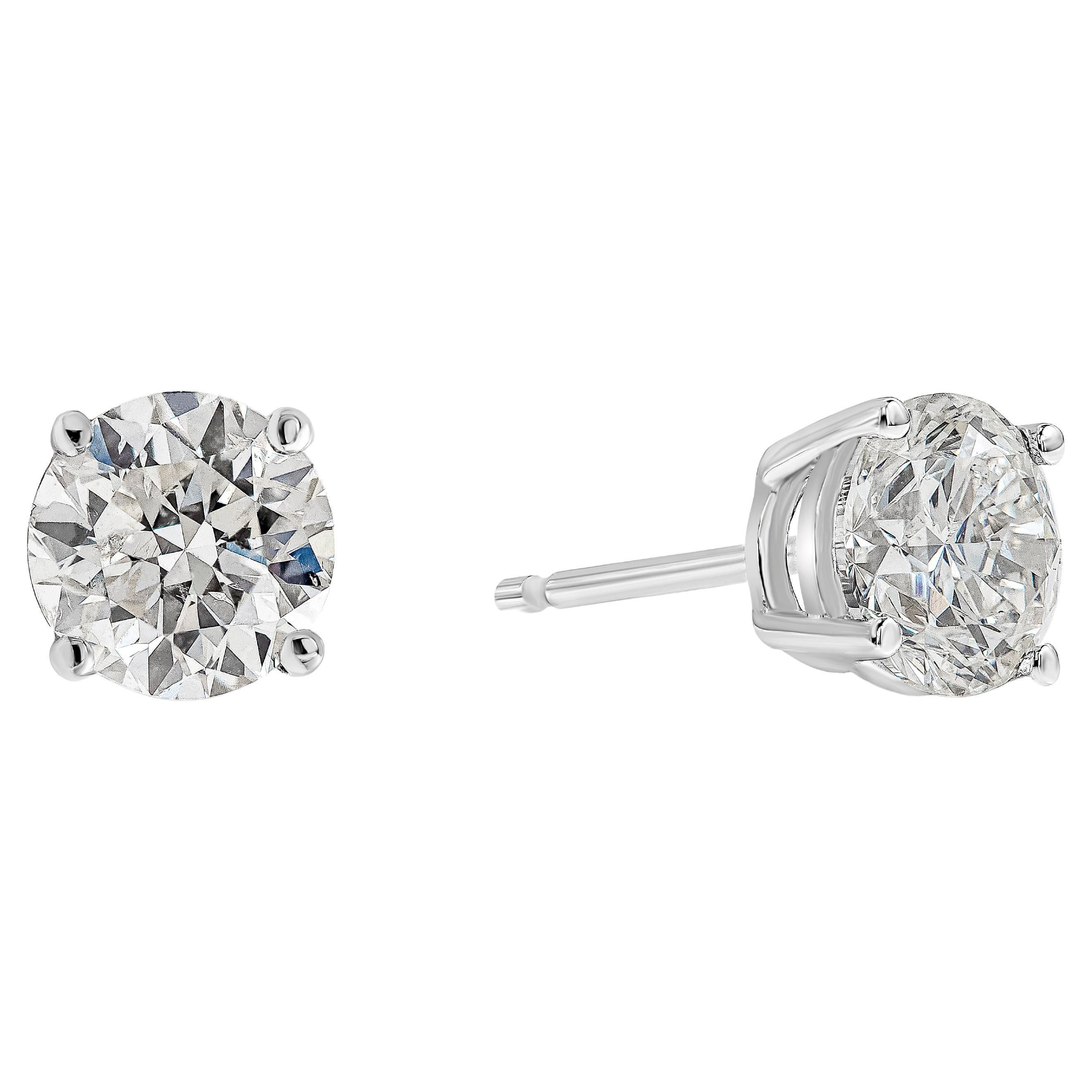 Showcasing a pair of round brilliant diamonds weighing 1.62 carats total, G color, SI3 in clarity. Set in an four prong basket setting and finely made in 18k white gold.

Style available in different price ranges. Prices are based on your selection.