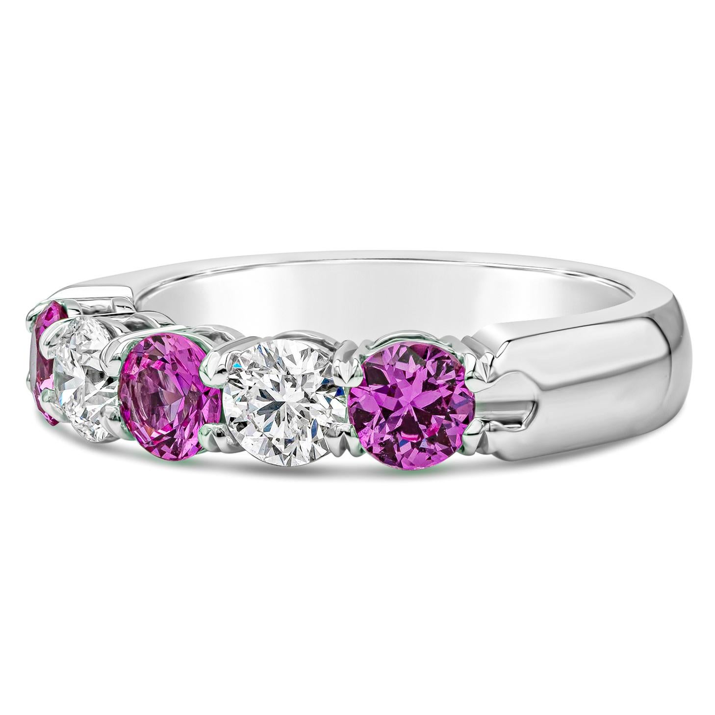 A pleasing five stone wedding band style showcasing alternating round cut pink sapphires and white diamonds set in a shared-prong open gallery setting. Pink Sapphires weighs 1.06, and white diamonds weighs 0.60 carats, E Color and Si2 in Clarity.