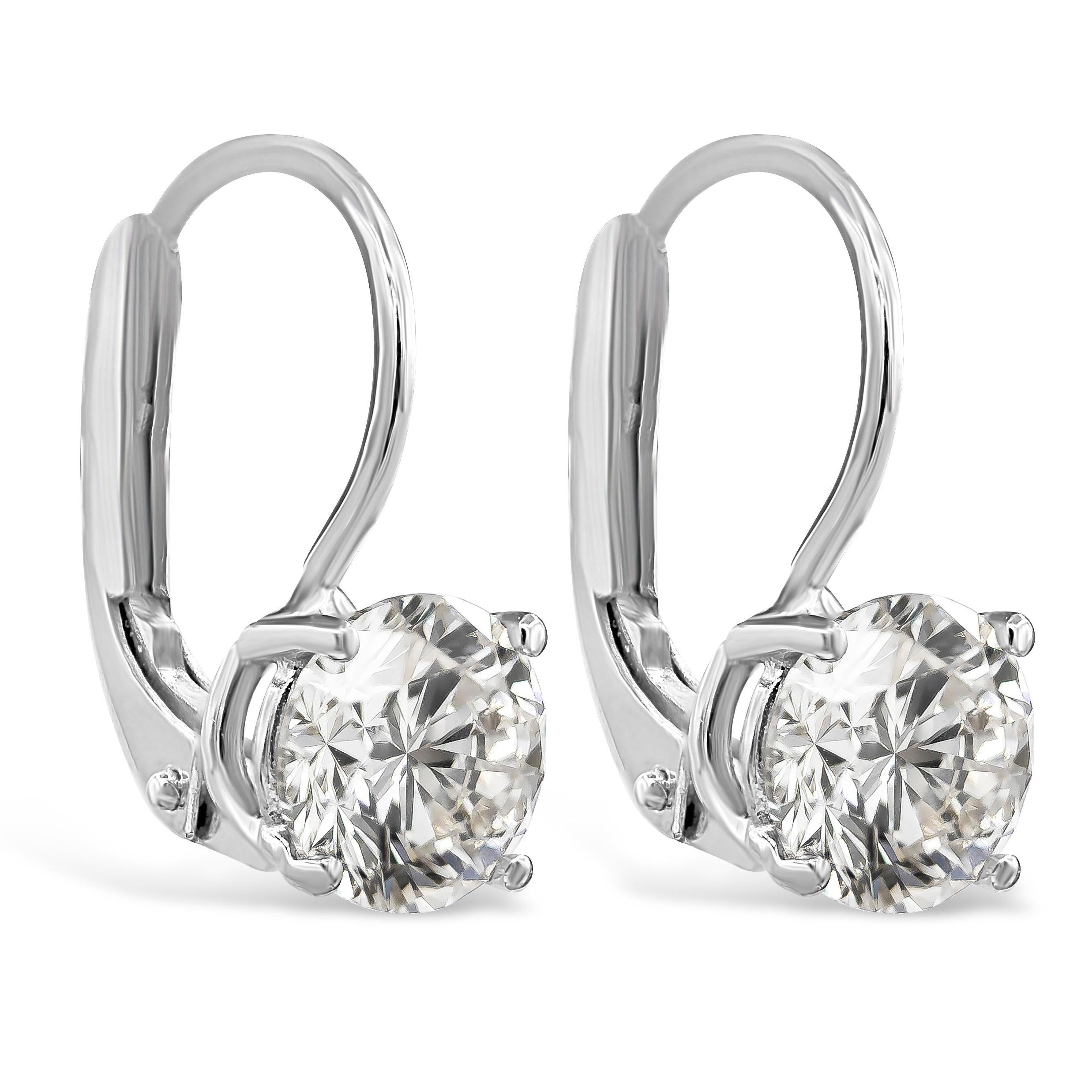 Showcasing a round brilliant diamonds, elegantly set in a lever-back drop setting made in 14k white gold. Set in a four prong basket setting. Diamonds weigh 1.70 carats total and are approximately H color, SI in clarity.

Roman Malakov is a custom