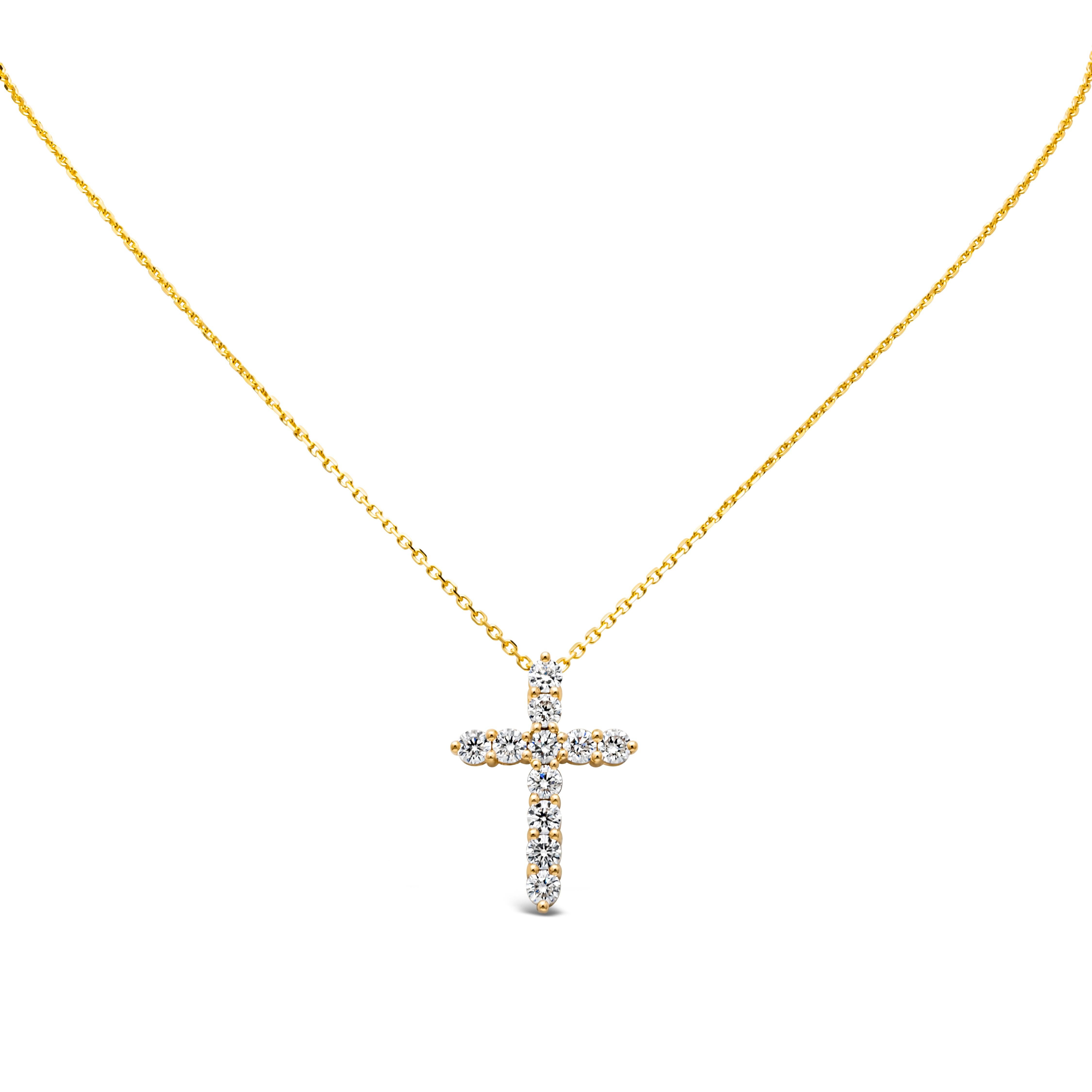 A classy and stunning pendant necklace showcasing 11 brilliant round cut diamond weighing 1.77 carats total, F color and SI1-SI2 in clarity, set in a religious cross design shared prong setting. Finely made in 18K Yellow Gold, Suspended on an 18