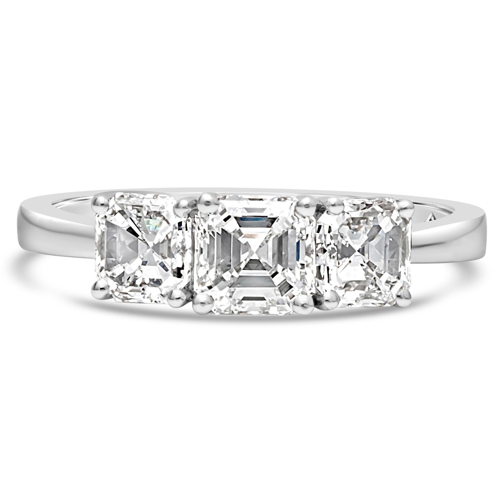 Finely crafted brilliant three-stone engagement ring set with three gorgeous asscher cut diamonds weighing 1.79 carats total. Set in a four prong 18K white gold basket and composition. Size 6.5 US and resizable upon request.

Roman Malakov is a