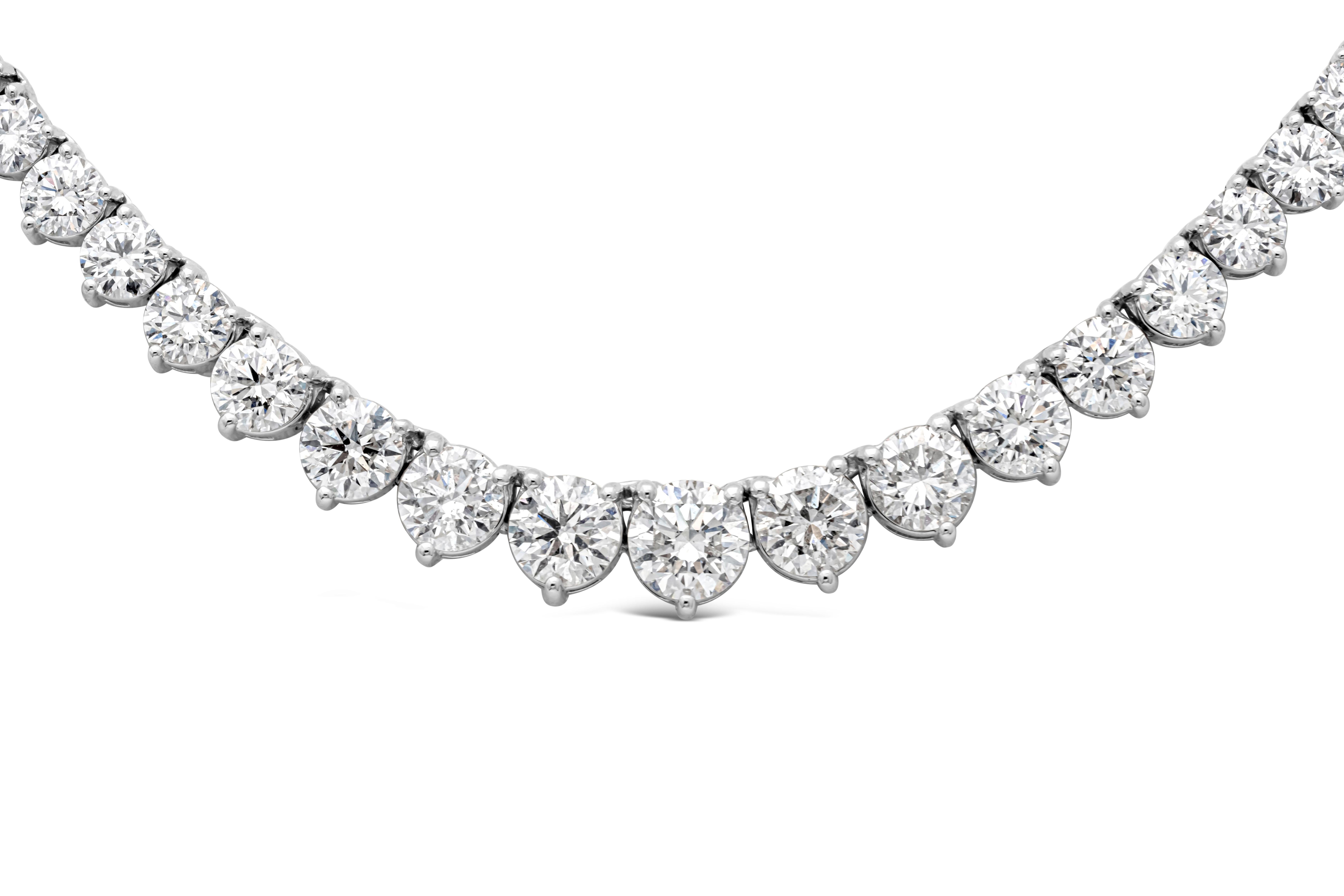 A brilliant and classic piece of jewelry showcasing a line of round brilliant diamonds that elegantly get larger to the center of the necklace. Diamonds weigh 18.00 carats total, largest diamond at the center weighs 1.02 carats E-G Color and SI in