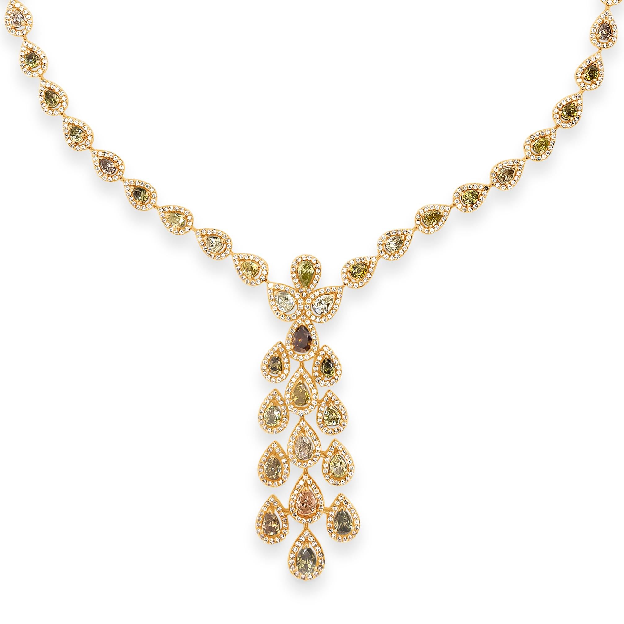 A well-crafted drop necklace, showcasing 61 natural fancy color pear shape diamonds of different shades weighing 13.08 carats total. Each stone is accented by a halo of round brilliant cut diamonds with an open work design. Accent diamonds weigh
