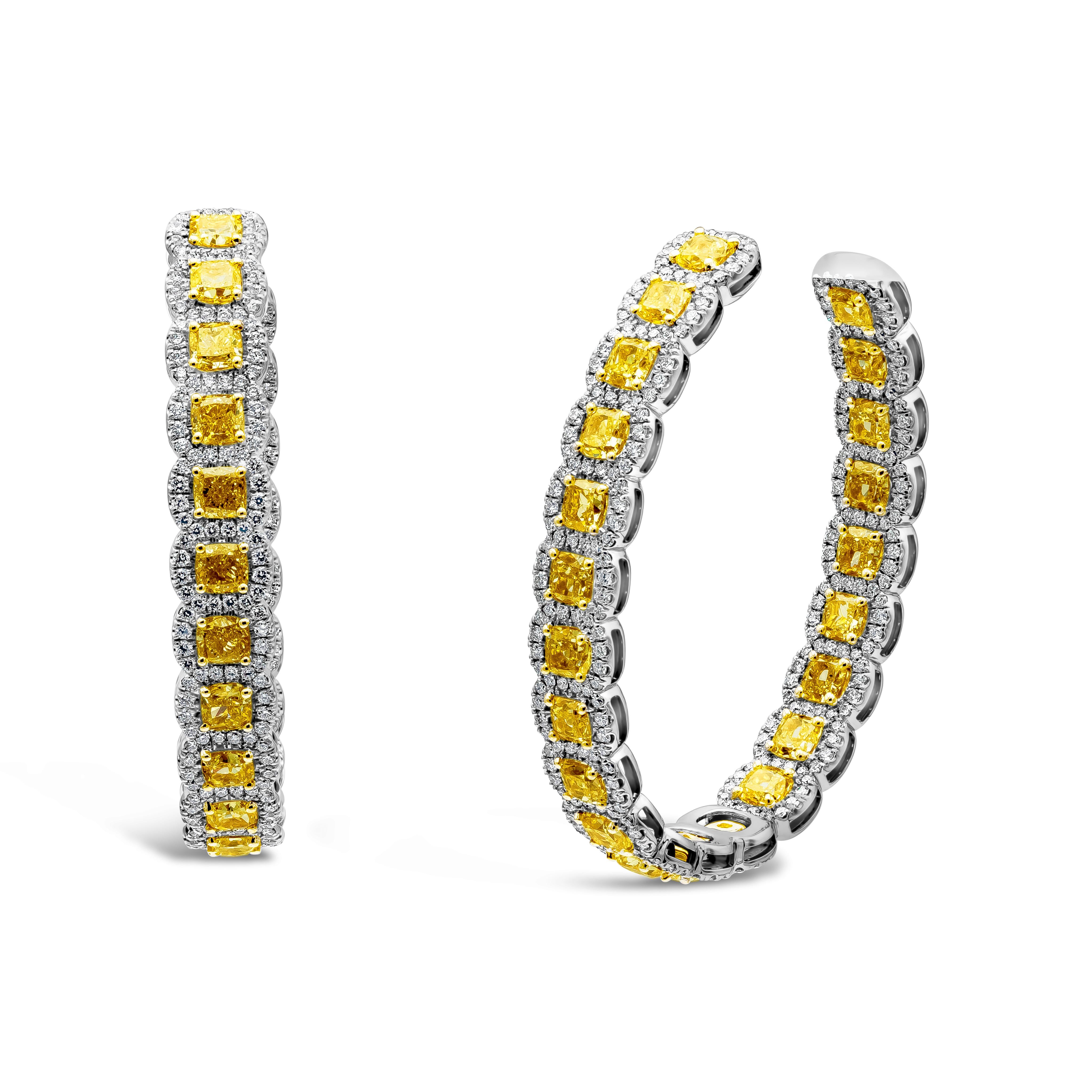 A unique and fashionably gorgeous Radiant Cut Yellow Diamonds weighing 15.28 carat, surrounded by dazzling white diamonds weighing 3.69 carats. Diamonds are F color and VS/SI in Clarity. Set in solid 18 karat white gold.

2 inch length by 1.50 inch