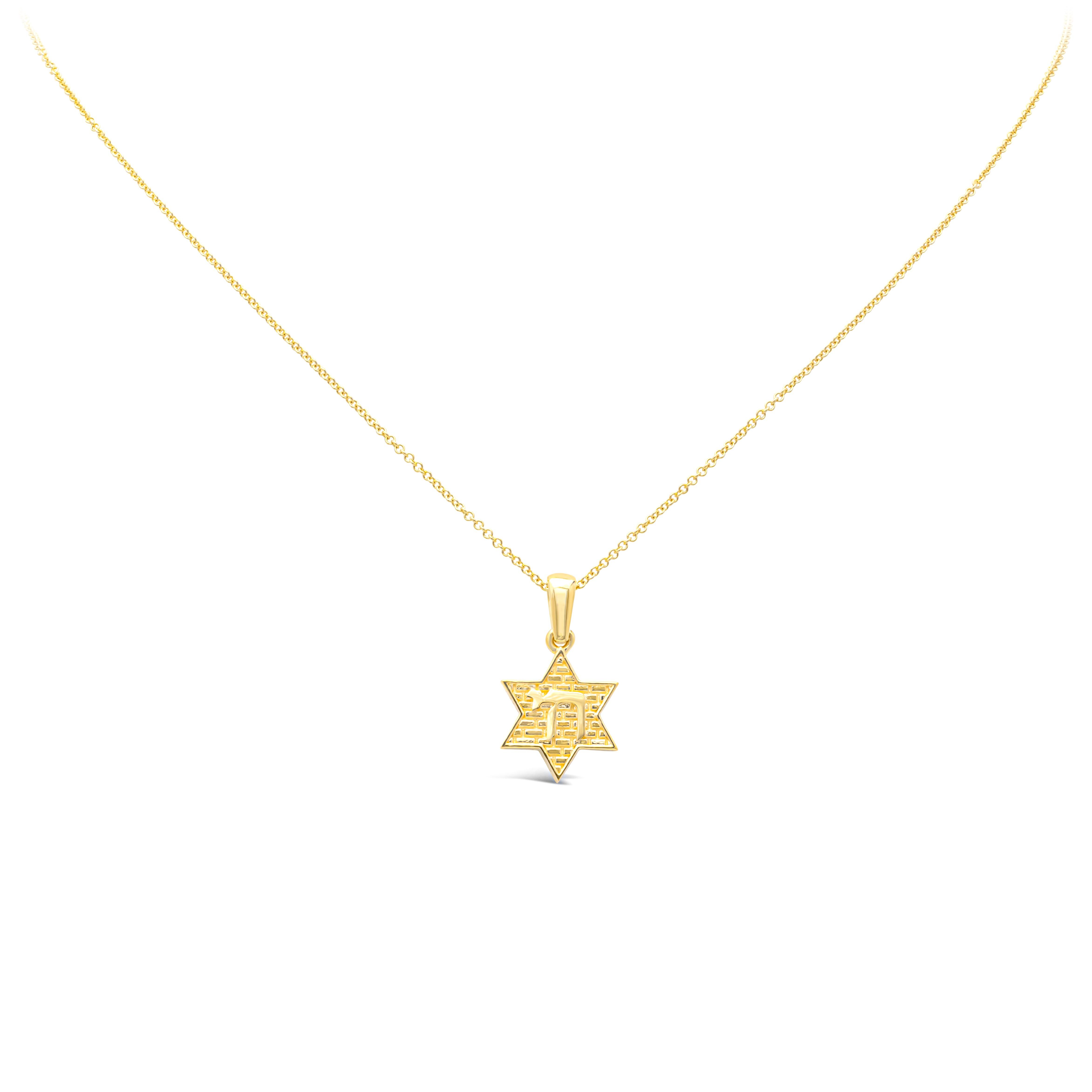 Showcasing an 18k yellow gold traditional religious star of David pendant necklace accented with 