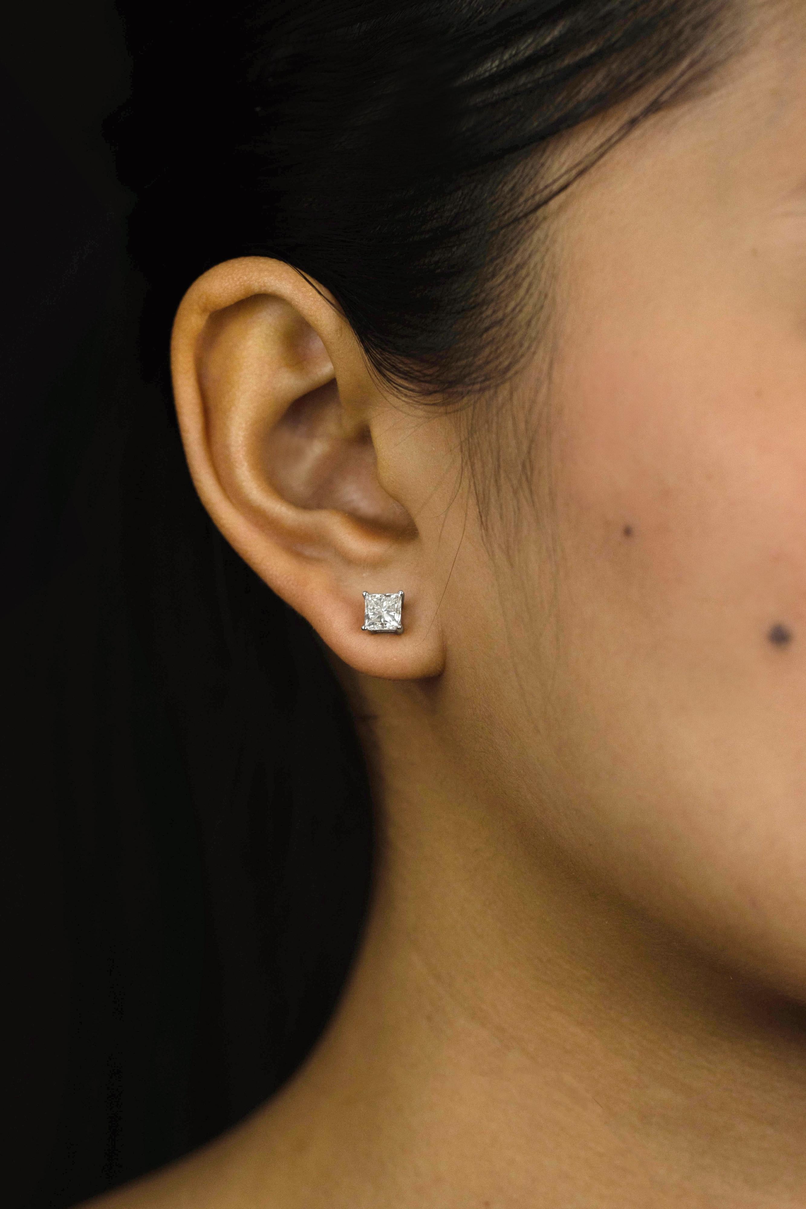 princess cut diamond earrings on ear