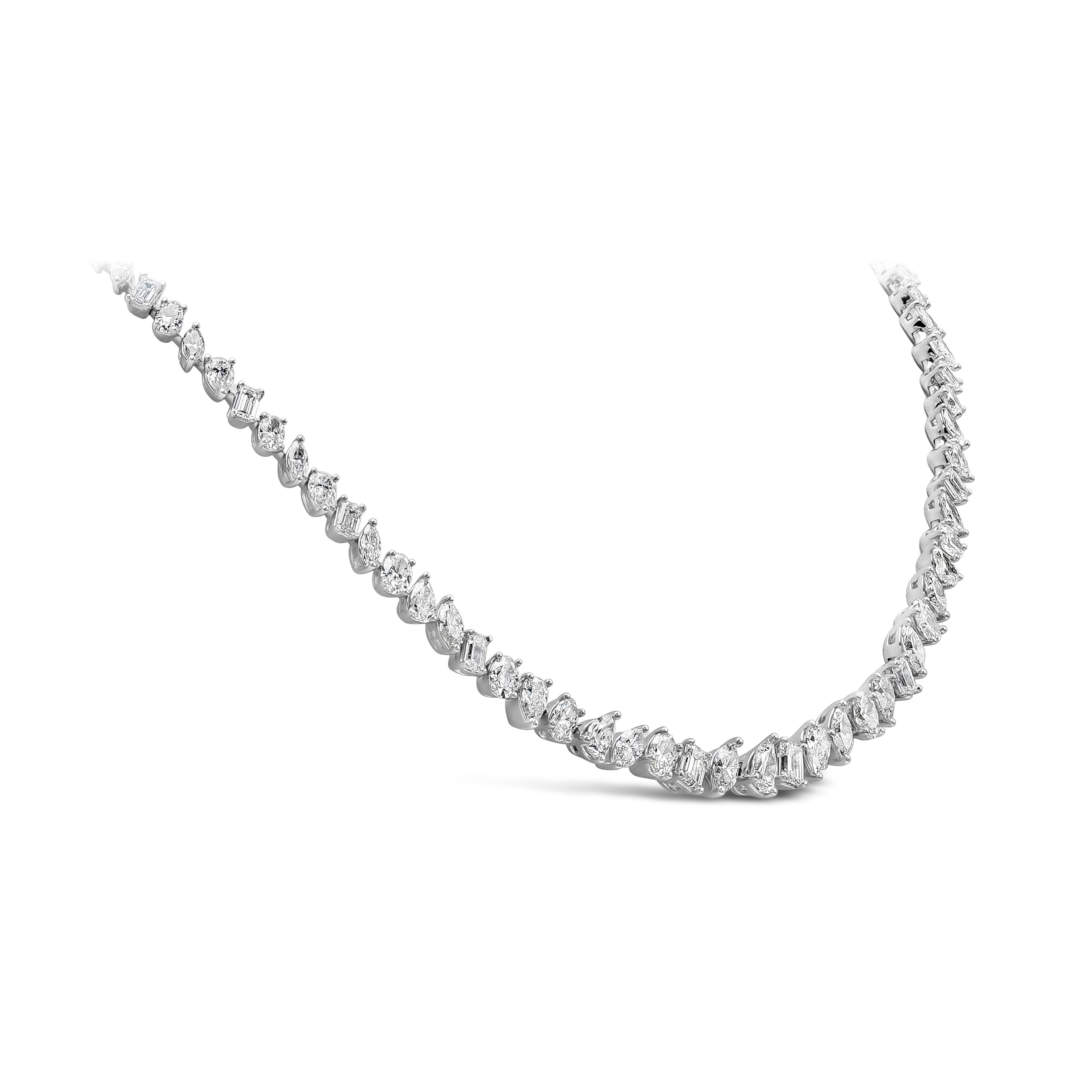 A riviera design necklace showcasing a row of fancy shape mixed cut diamonds graduating in size, set in an intricately-designed 18K white gold mounting. Diamonds weigh 19.38 carats total and are approximately G-H color, VS-SI in clarity. 16.63