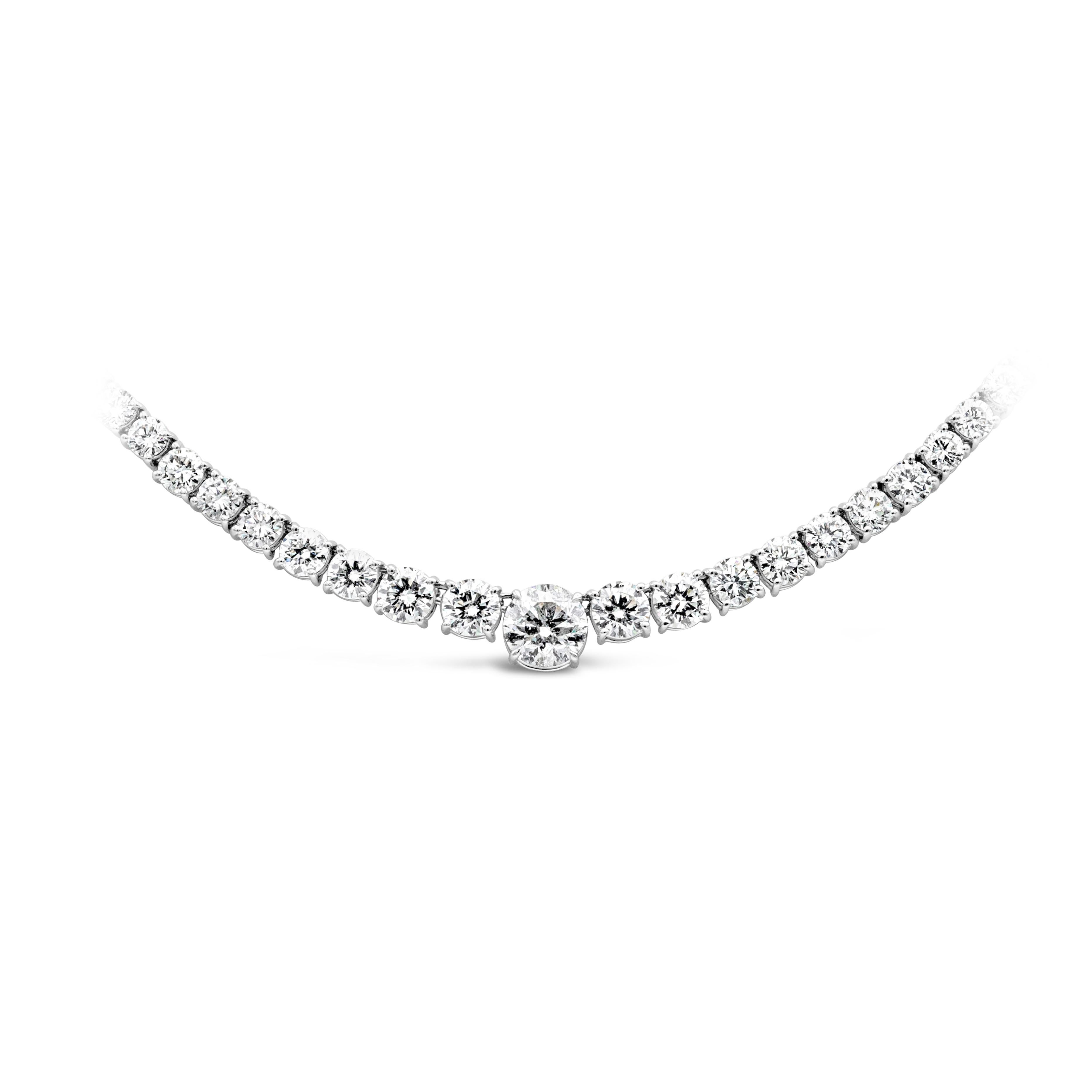  A brilliant and classic piece of jewelry showcasing a line of round brilliant diamonds that elegantly get larger to the center of the necklace. Largest diamond at the center weigh 2.02 carats and GIA certified as H Color and I2 in clarity while the
