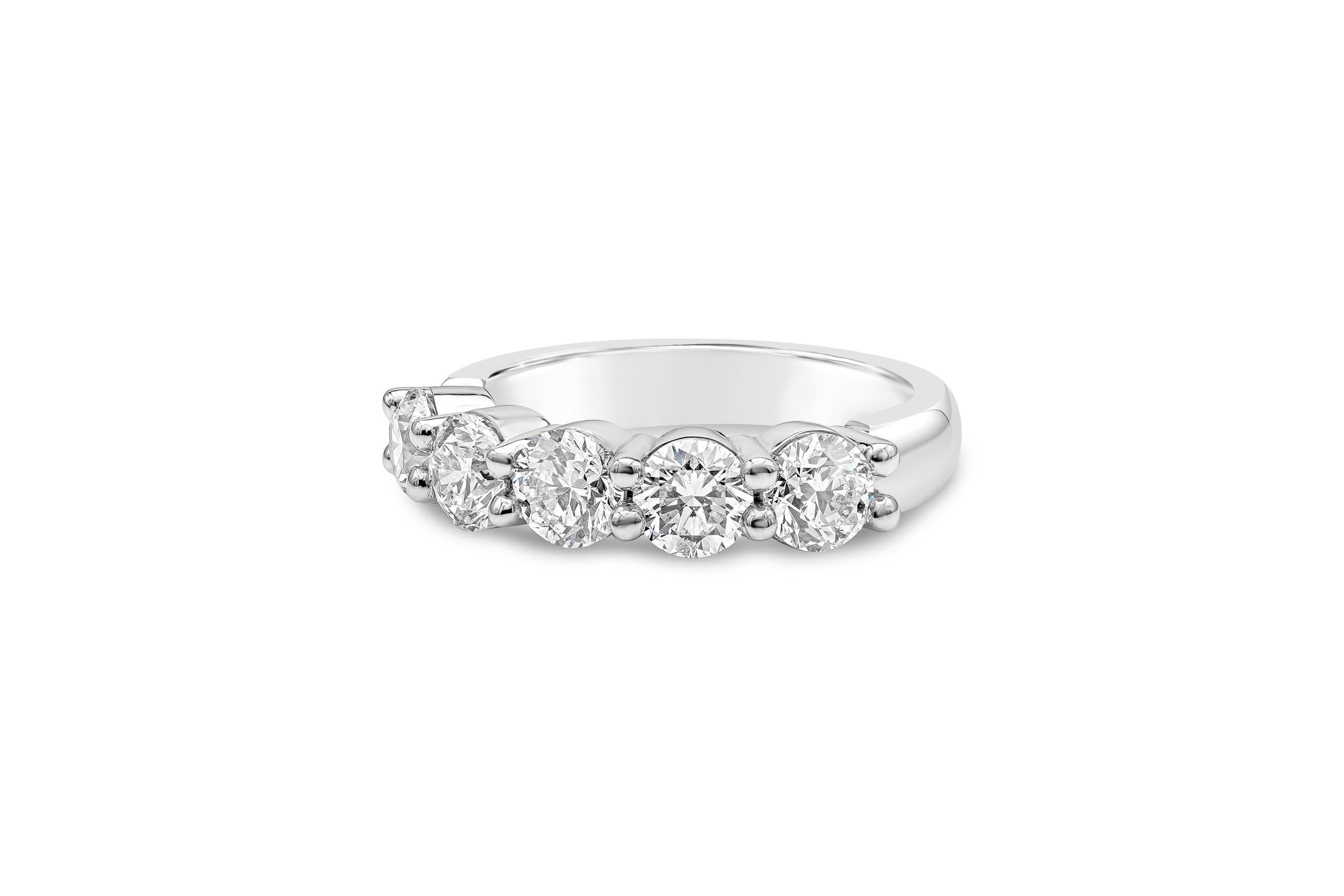 A classic wedding band style showcasing five round brilliant diamonds set in a shared prong. Diamonds weigh 2.02 carats total, E-F Color and SI in Clarity. Made with Platinum. Size 6 US.

Style available in different price ranges. Prices are based