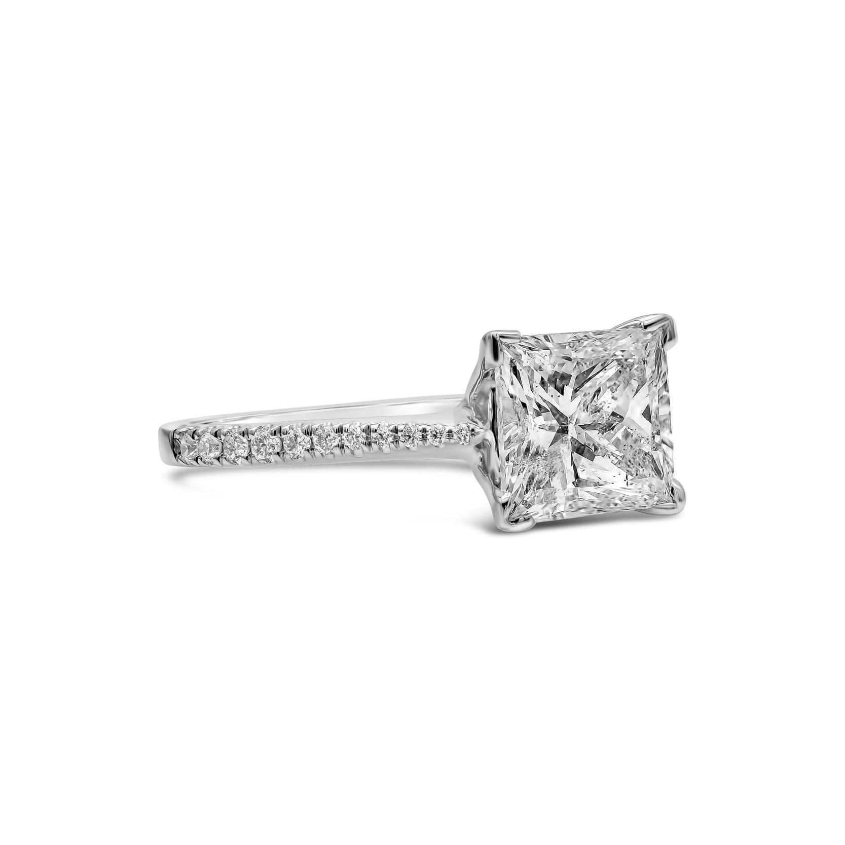 A classic and timeless diamond engagement ring showcasing a 2.03 carats princess cut diamond, beautifully set in a diamond encrusted shank mounting made in 18k white gold. Center diamond is approximately G color, SI3 in clarity. Accent diamonds