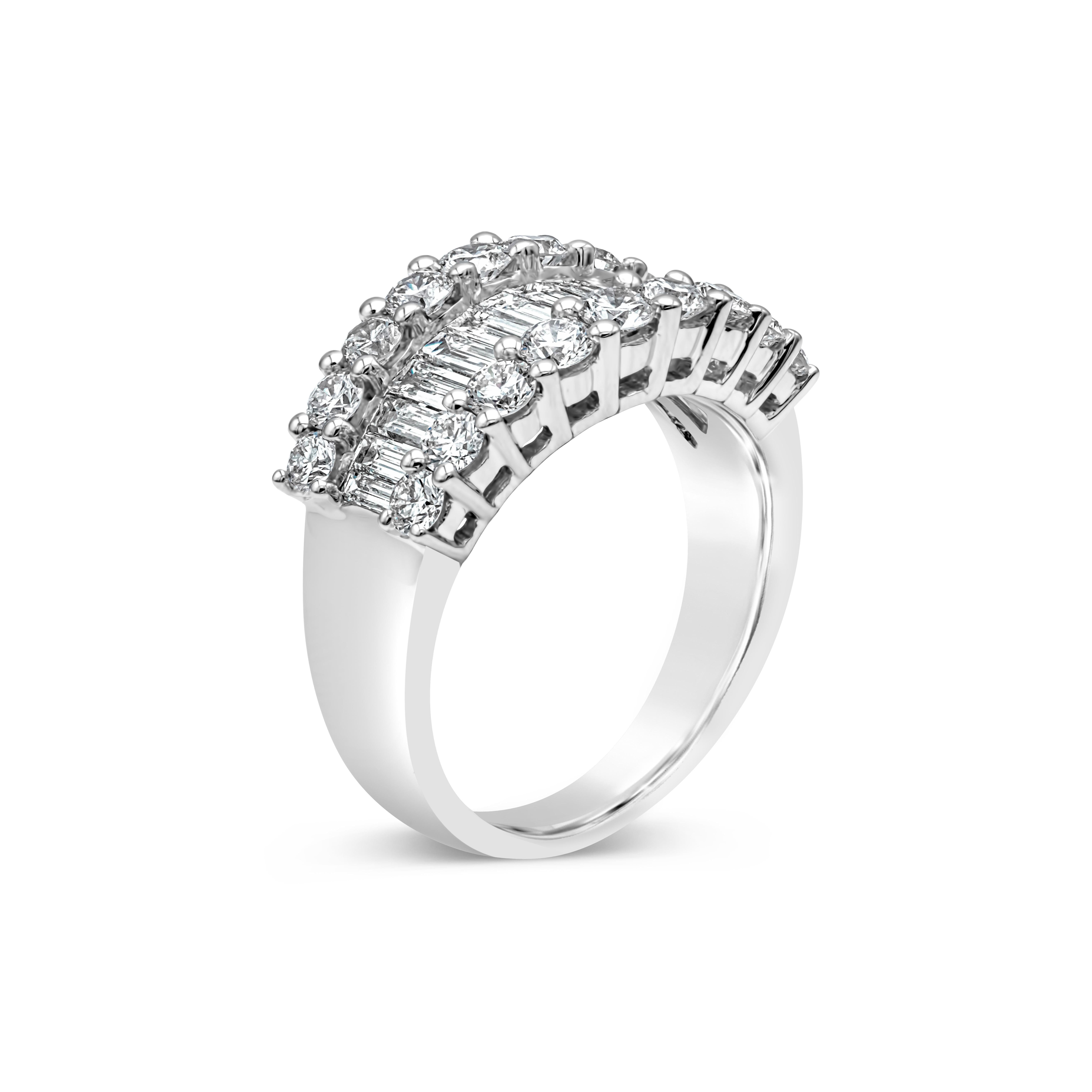 A chic diamond band showcasing 14 baguette diamonds that elegantly graduate in size, finished with 18 brilliant round diamonds on either side of the ring. Baguette diamonds weigh 0.84 carats total, F color and VS clarity. Round diamonds weigh 1.19