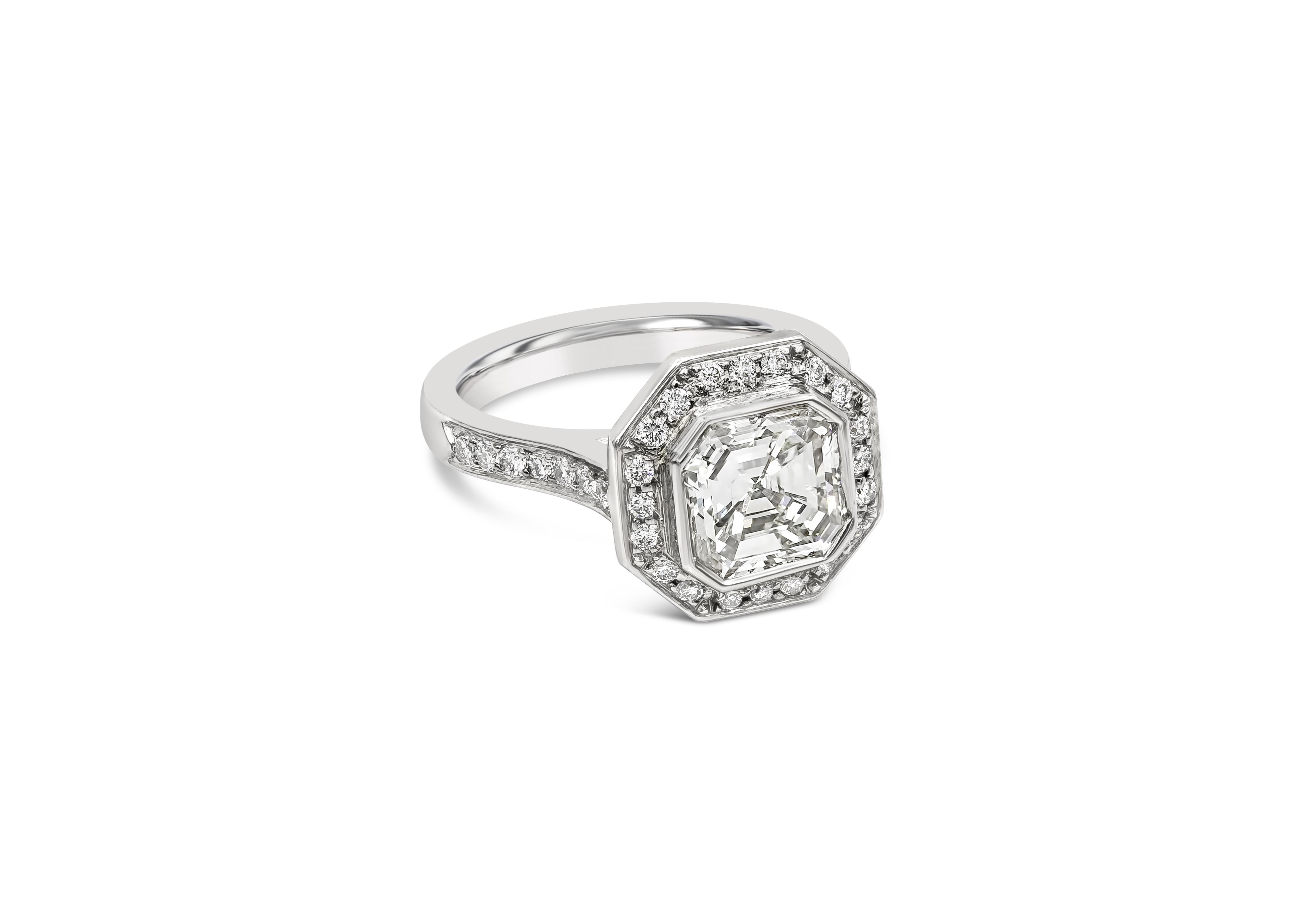 This beautiful halo engagement ring showcasing a EGL certified 2.07 carats asscher cut diamond, bezel set in a brilliant diamond halo. Set in a polished platinum band accented with brilliant round diamonds in half eternity setting. Accent diamonds