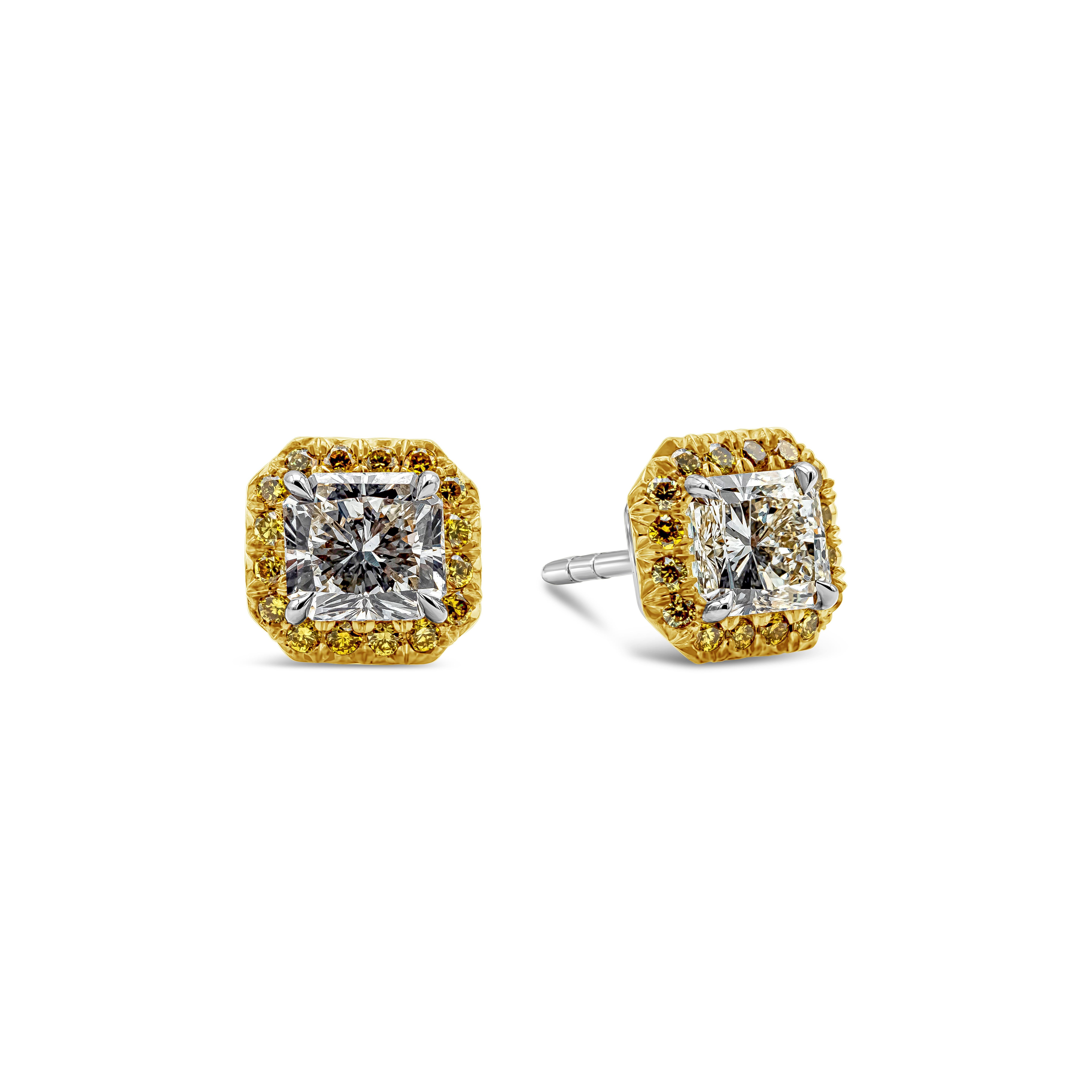 This beautiful pair of earrings showcases radiant cut diamonds weighing 1.73 carats total, K-L Color and VS1- VS2 in Clarity. Surrounded by a row of round brilliant very yellow diamonds weighing 0.35 carats total, VS in Clarity. Made with
