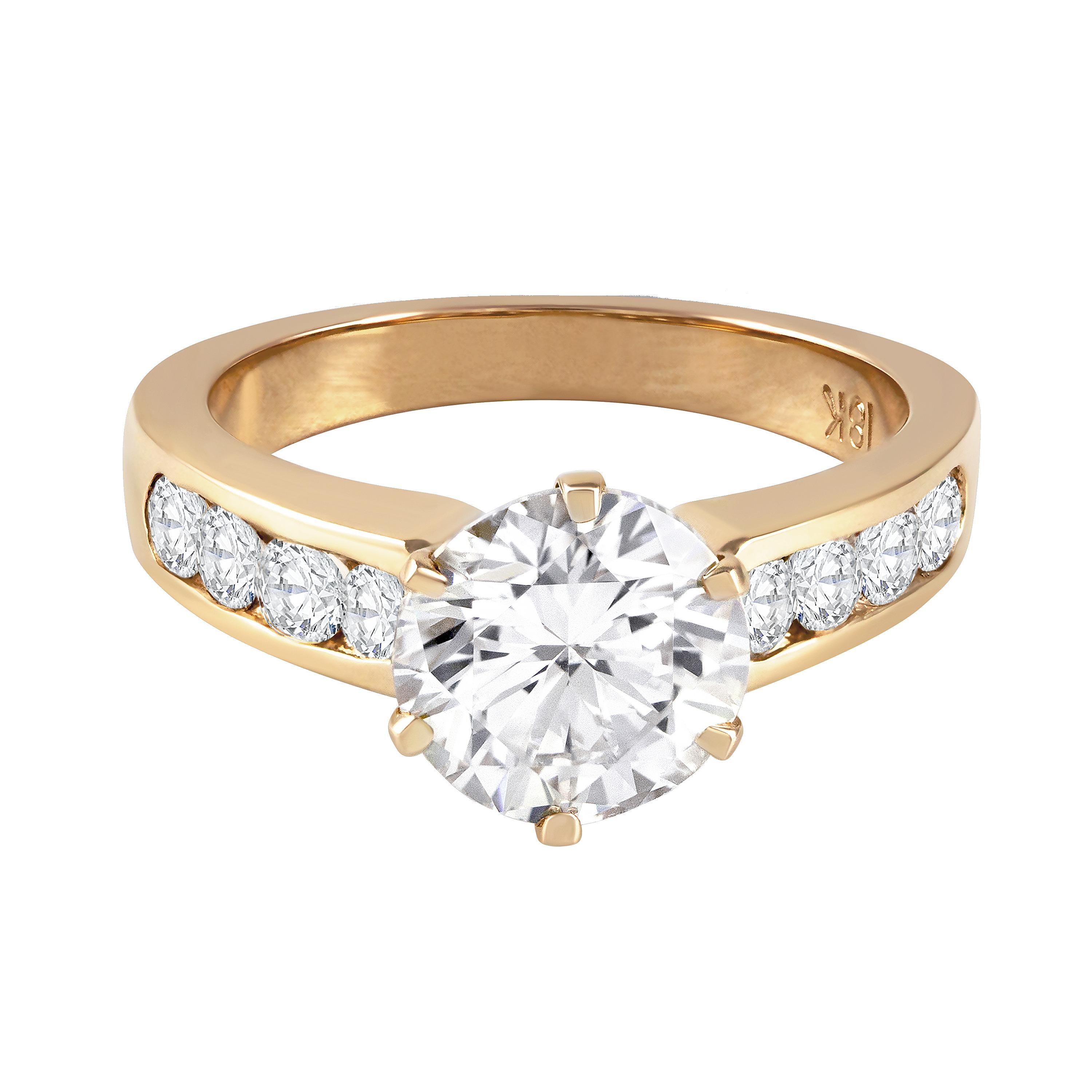 This style engagement ring is classic and timeless for a reason. Features a 2.15 carat brilliant round diamond center stone securely set in 6 prongs and accented by 0.50 carats of sparkling diamonds on either side of the ring. The accent diamonds
