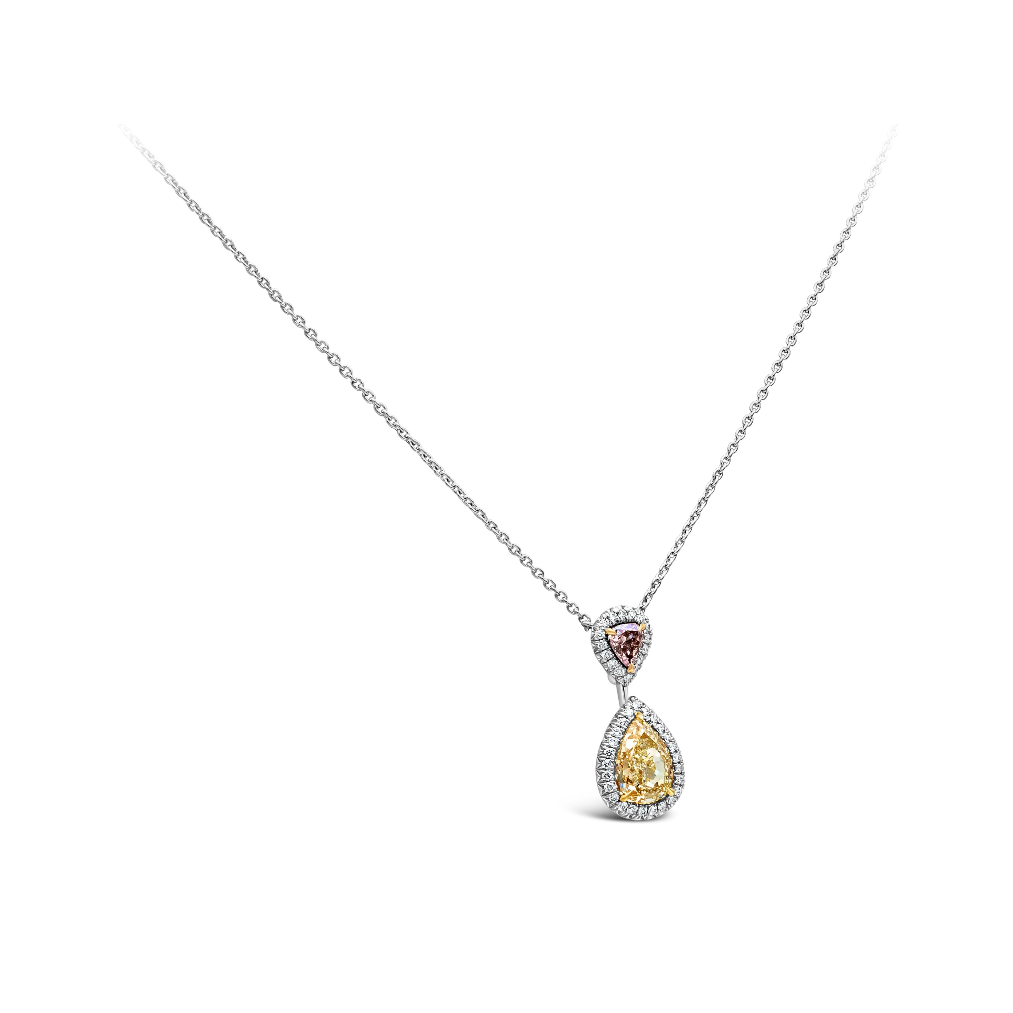 This beautiful pendant necklace showcasing a GIA Certified 1.69 carat pear shape light yellow diamond suspended on a GIA Certified 0.25 carat heart shape fancy blue pink diamond. Surrounded by 41 brilliant round white diamonds weighing 0.22 carts