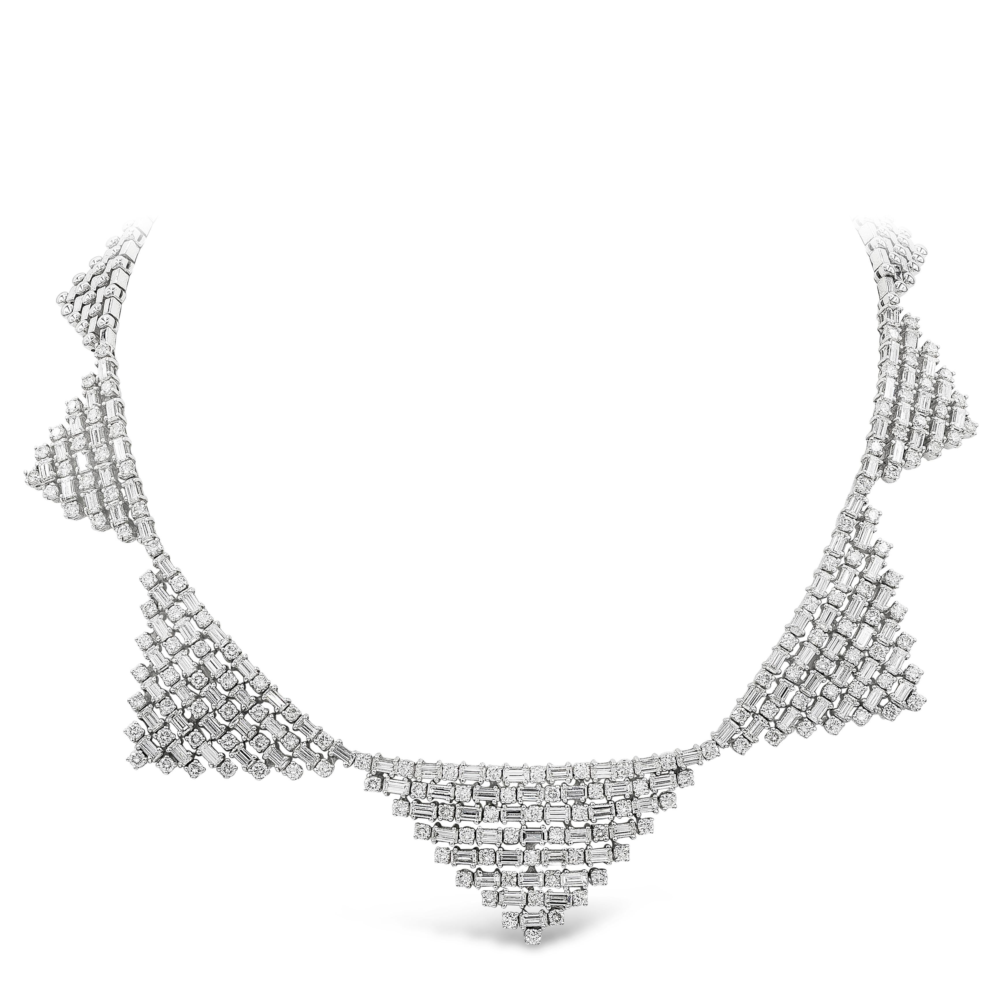 A fascinating and stylish necklace showcasing baguette and round cut diamonds set in a beautiful triangular design. Baguette diamonds weigh 15.60 carats total; round diamonds weigh 6.73 carats total. Finely made in 18K white gold.

Roman Malakov is