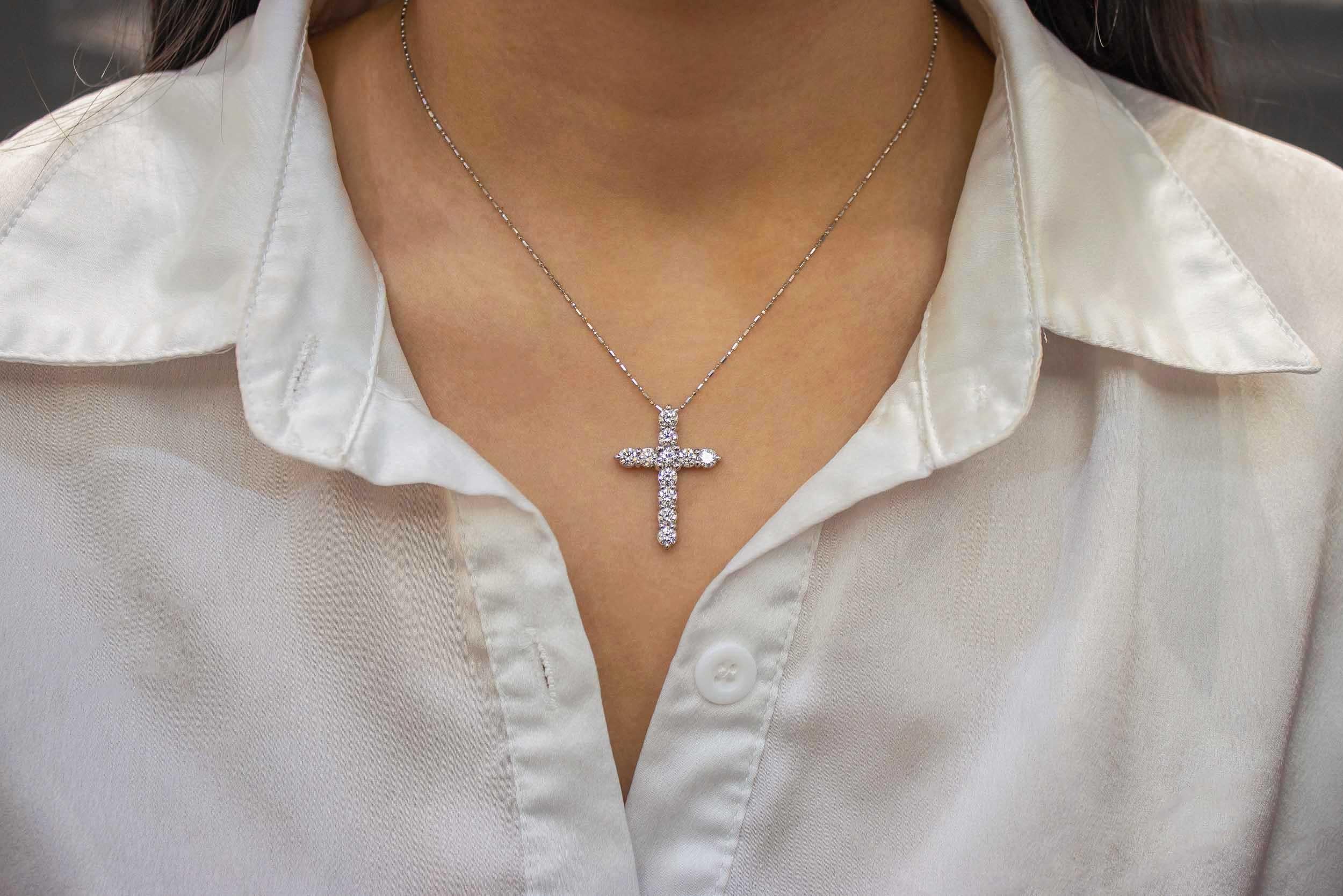 A classic cross design set with 2.24 carats total of round brilliant diamonds. Diamonds  quality are G color, VS clarity; and suspended in a 14k white gold mounting and chain. 16 inch chain length (adjustable upon request).

Roman Malakov is a