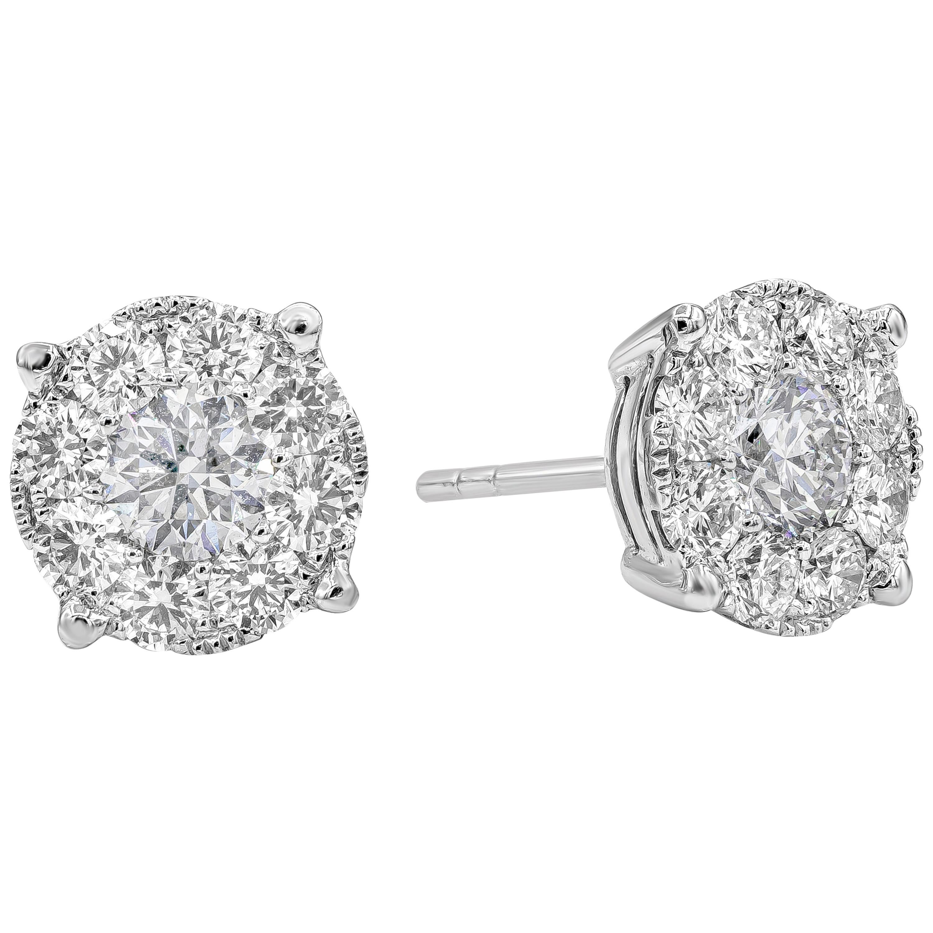 A versatile piece of stud earrings feature a cluster of brilliant round diamonds set in an illusion design. Two center diamonds weighing 0.95 carats total surrounded by melee round diamond around weighing 1.29 carats total. Made with 18K White