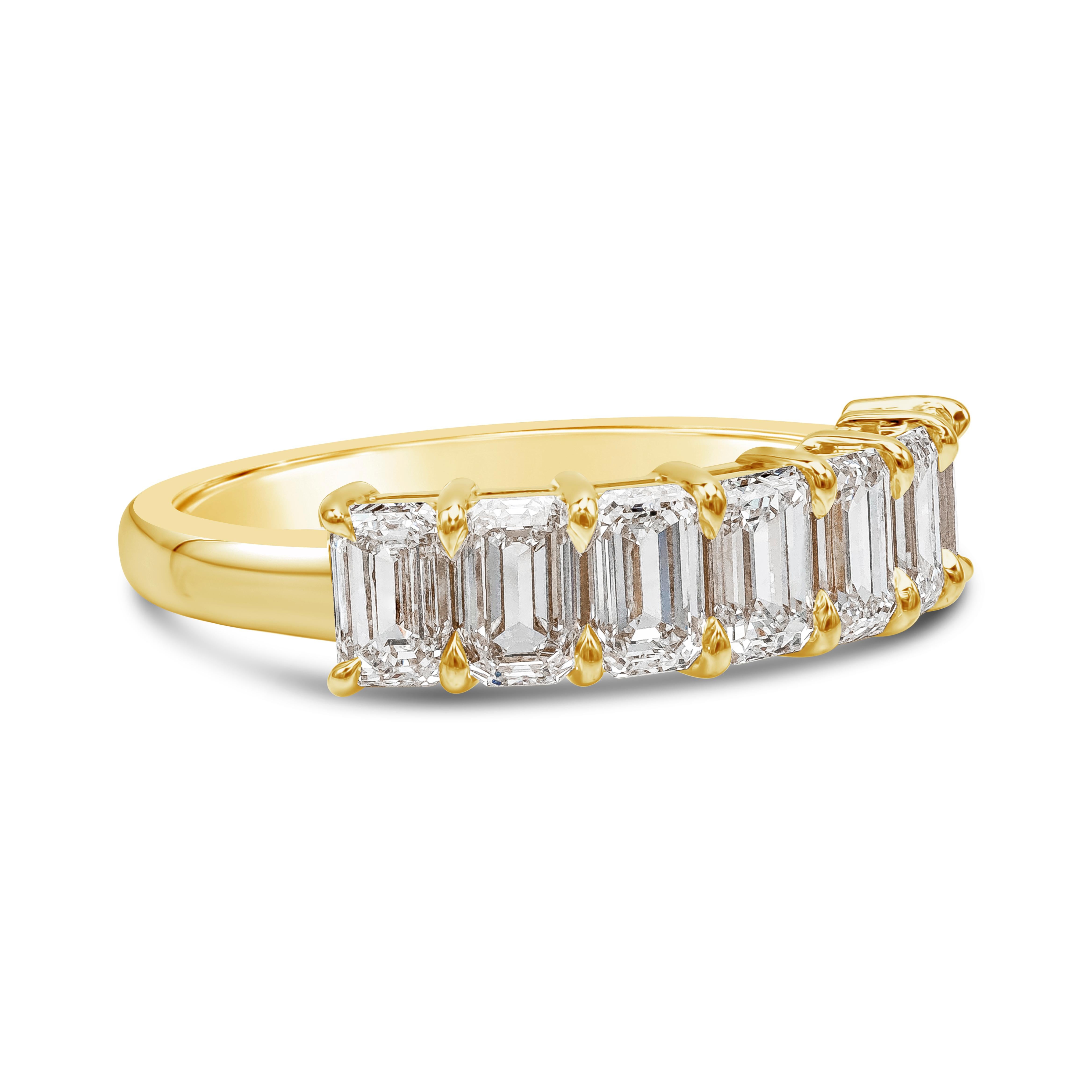 A classic wedding band ring style showcasing seven emerald cut diamonds weighing 2.25 carats total, F color and VS in clarity, set in a timeless shared-prong basket setting. Made in 18K Yellow Gold, Size 6.5 US resizable upon request.

Style