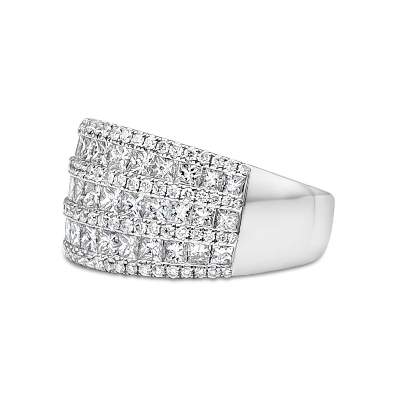 A timeless and fashionable wide triple rows fashion ring showcasing 94 brilliant round diamonds that elegantly graduating and designed with three rows of 39 princess cut diamonds. Brilliant round diamonds weigh 0.46 carats total, F Color and VS-SI