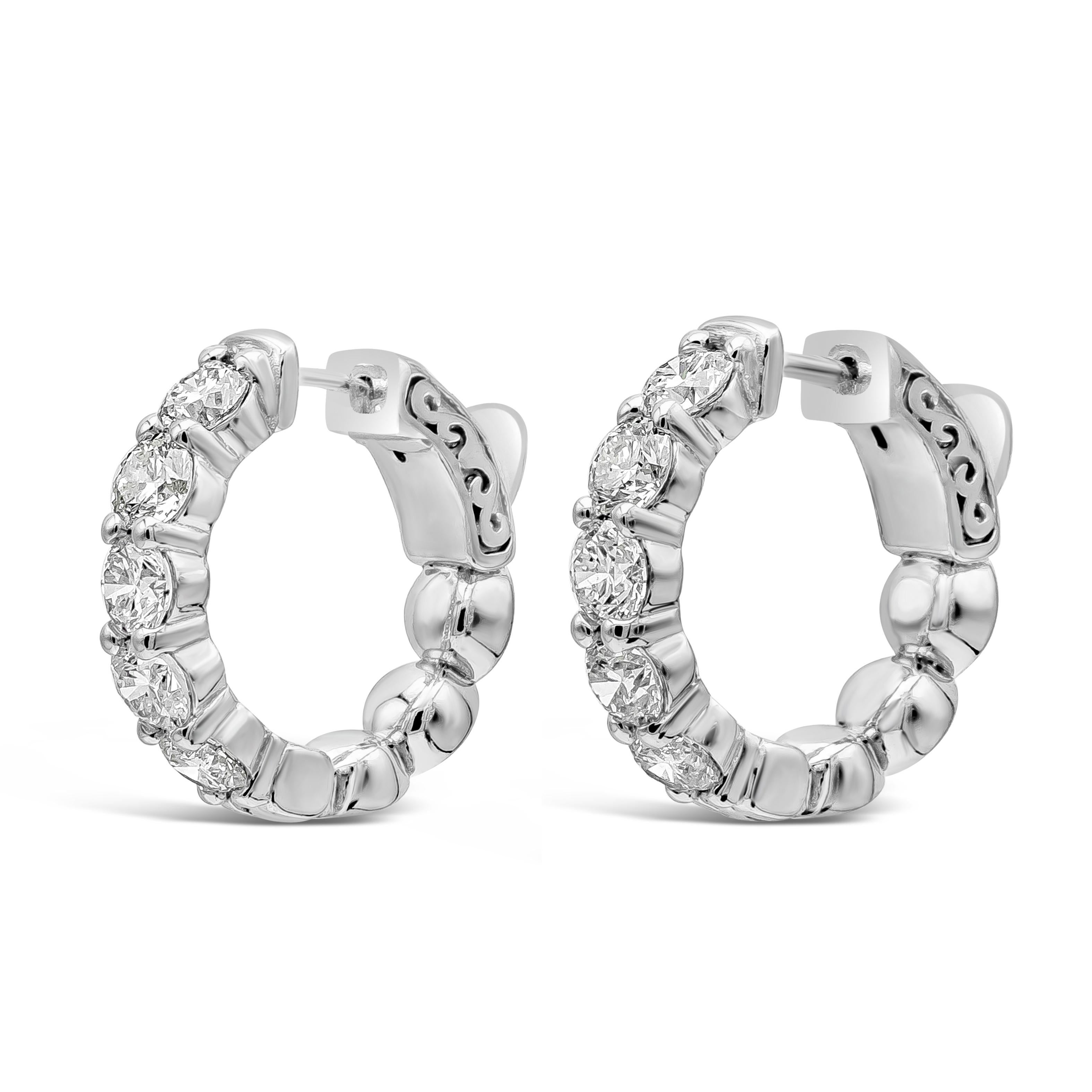 A classic and versatile style hoop earrings showcasing round brilliant diamonds weighing 2.30 carats total, G-H Color and VS-SI in Clarity. Set in a shared prong setting and finely made in 14k white gold. 0.75 inch diameter.

Roman Malakov is a