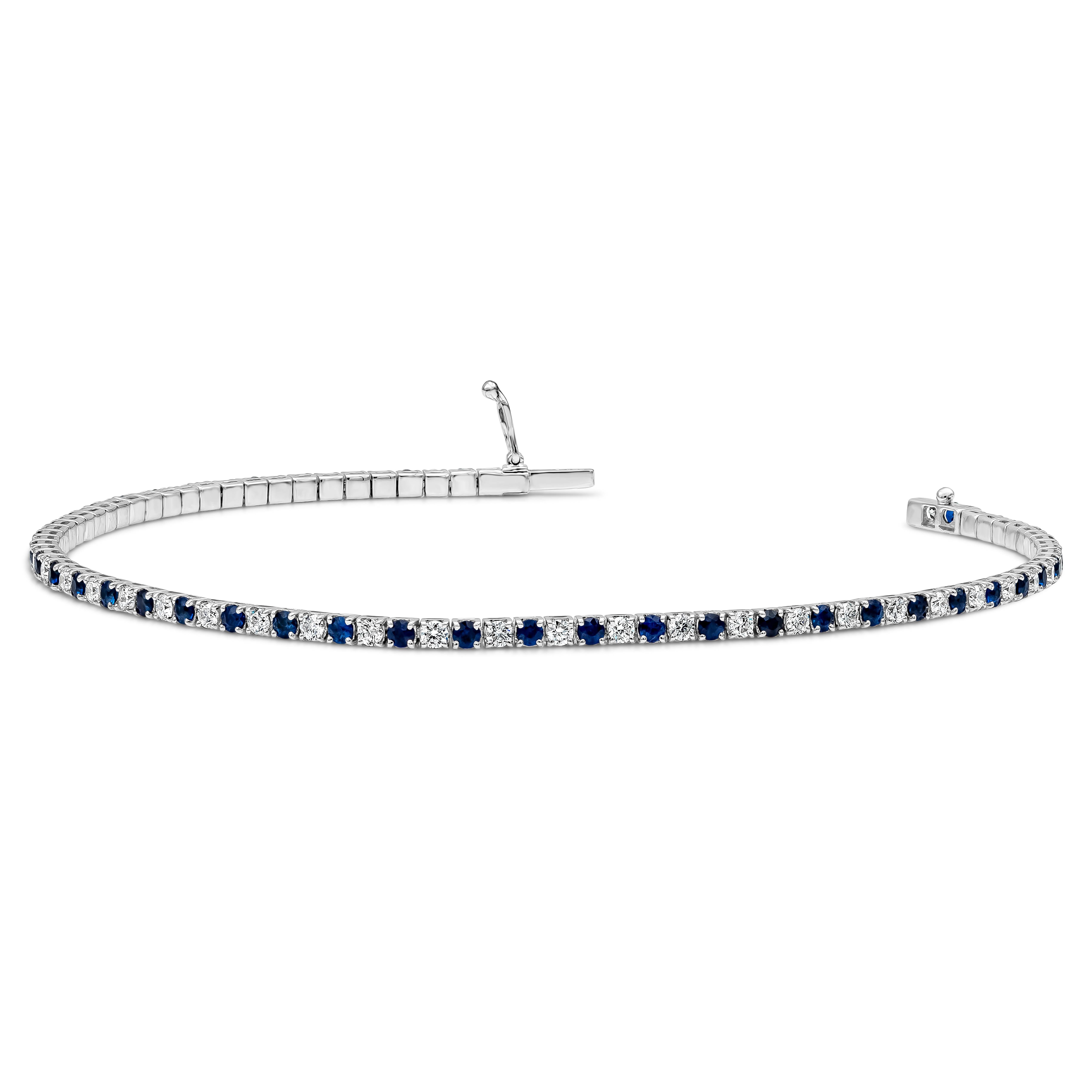 This tennis bracelet features a row of alternating round brilliant cut blue sapphires and round brilliant cut diamonds. Blue Sapphire weighs 1.39 carats and diamonds weigh 0.99 carats in F color and VS-SI in Clarity. Made with 18K White Gold. 7