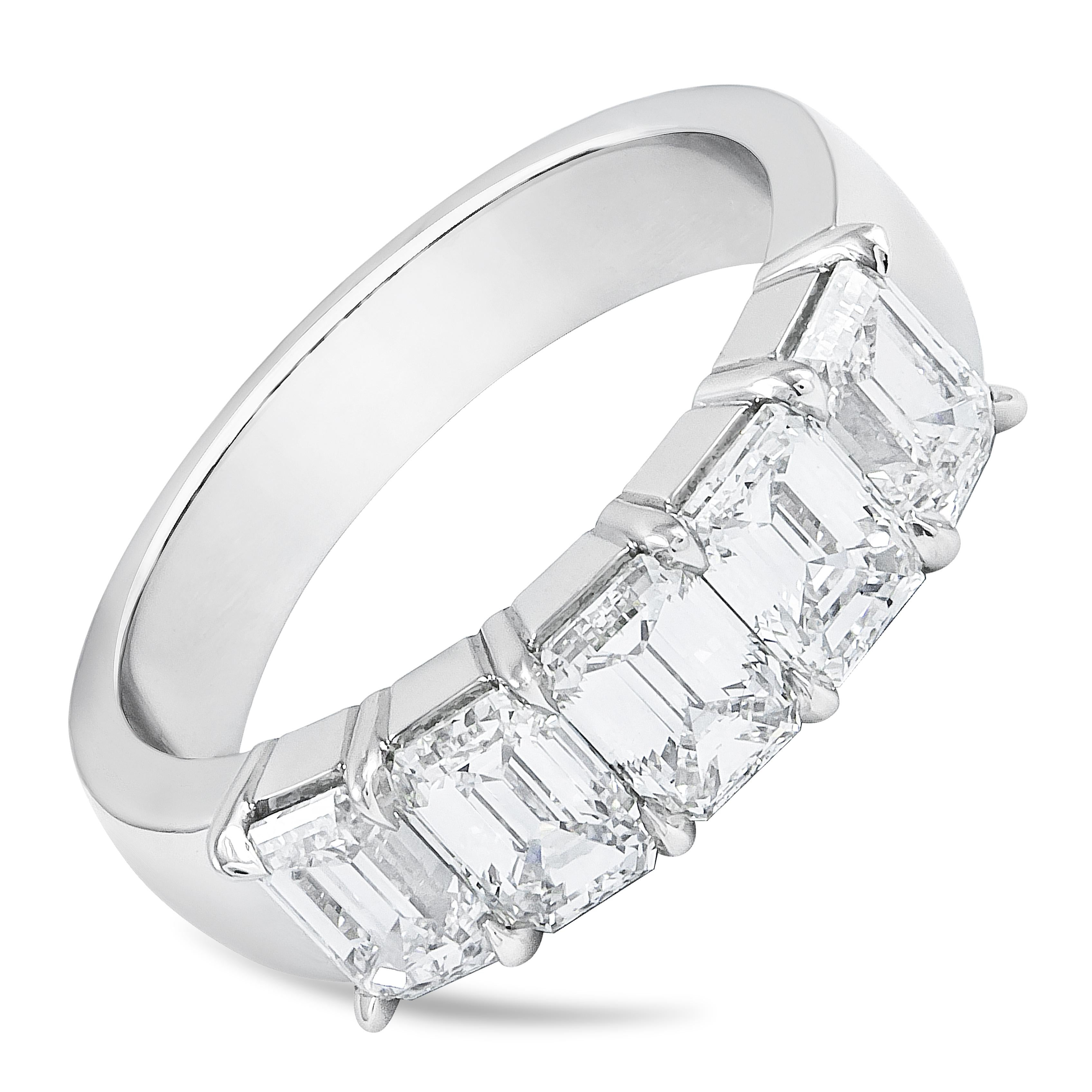 A classy and unique wedding band showcasing 5 perfectly matched emerald cut diamonds weighing 2.53 carats total, H color and VS in clarity, set in a timeless shared prong setting and Finely made in Platinum. Size 6.25 US resizable upon request and