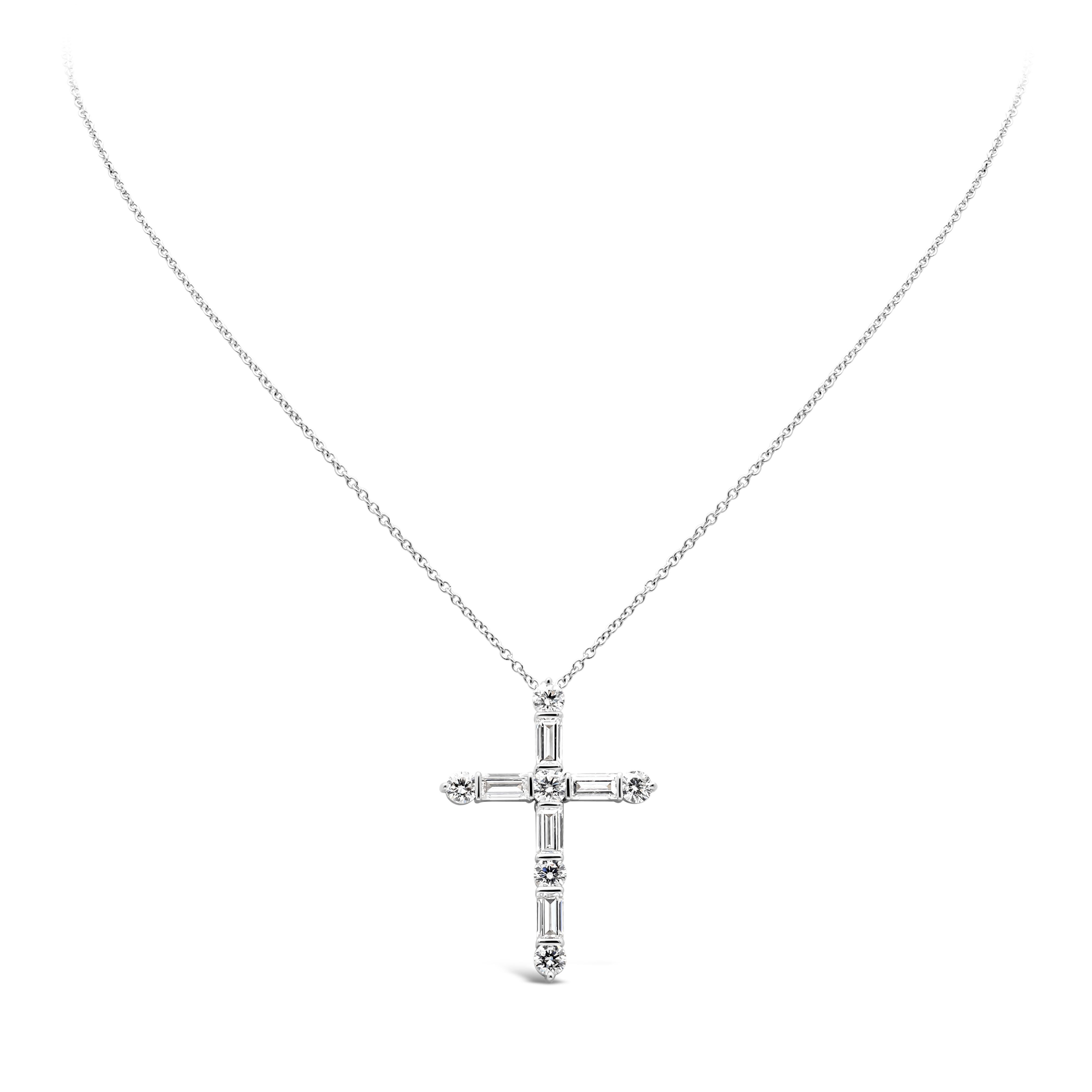 Showcasing a classic and simple religious cross pendant necklace set with baguette cut diamonds and brilliant round cut diamonds weighing 2.53 carats total, G color and VS in clarity respectively. Suspended on an adjustable 18inches white gold