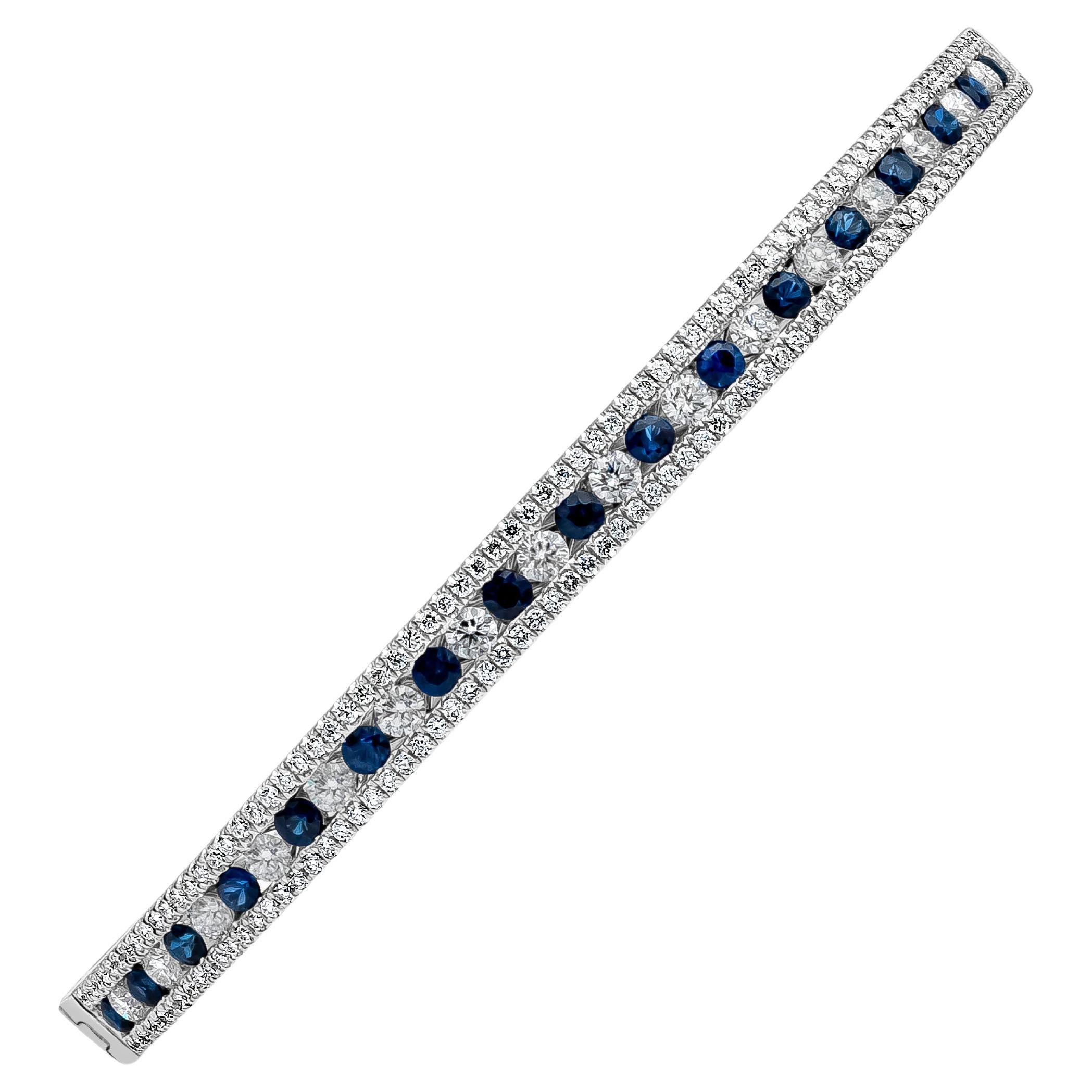 This chic-style piece features a alternating round brilliant cut blue sapphire and diamonds bangle bracelet. Blue Sapphire weigh 1.12 carats total and diamonds weigh 1.51 carats total, F-G in Color and VS-SI in Clarity. Accented by a single row of