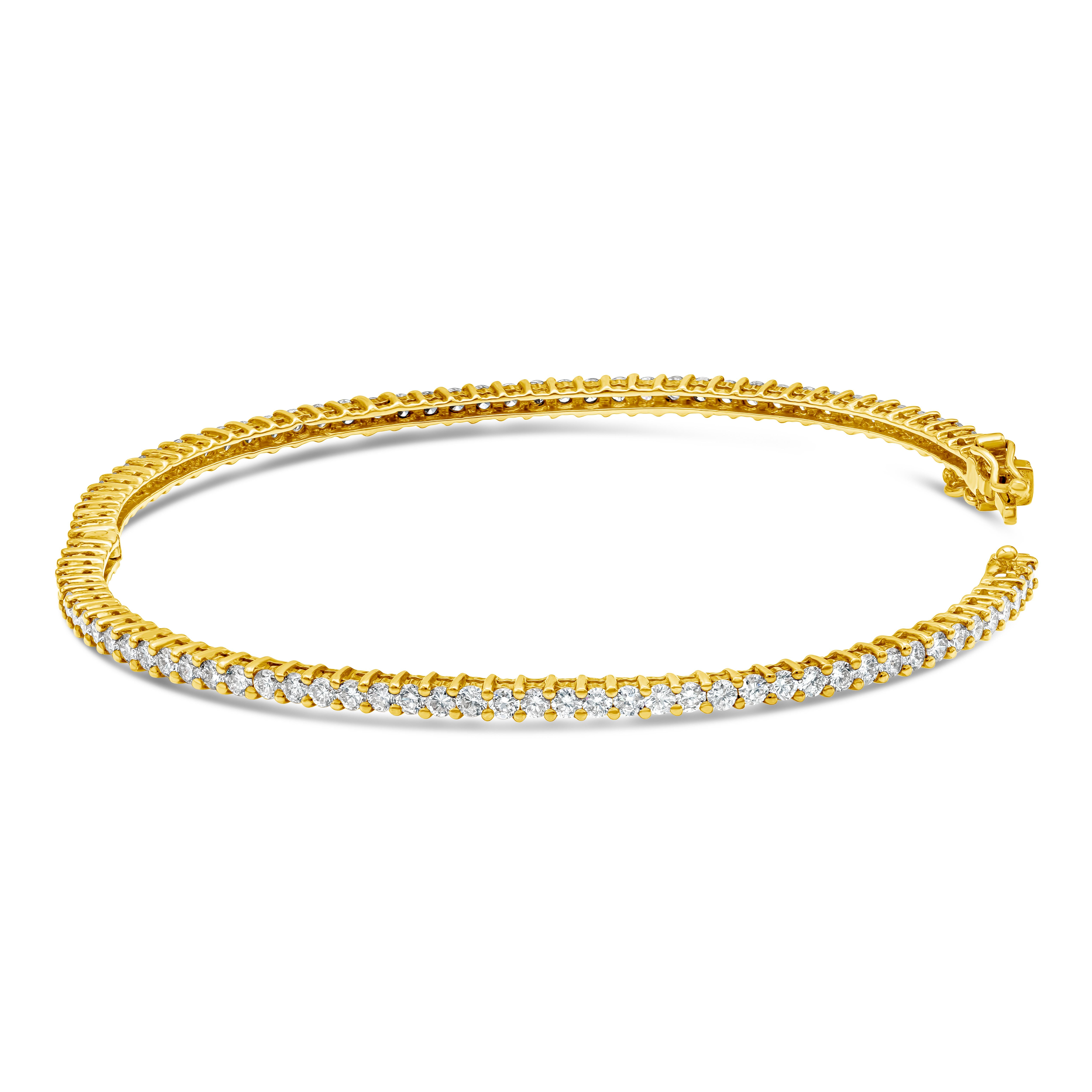 A classic bangle bracelet eternity encrusted with round brilliant diamonds weighing 2.78 carats total. Made with 18K Yellow Gold.

Roman Malakov is a custom house, specializing in creating anything you can imagine. If you would like to receive a