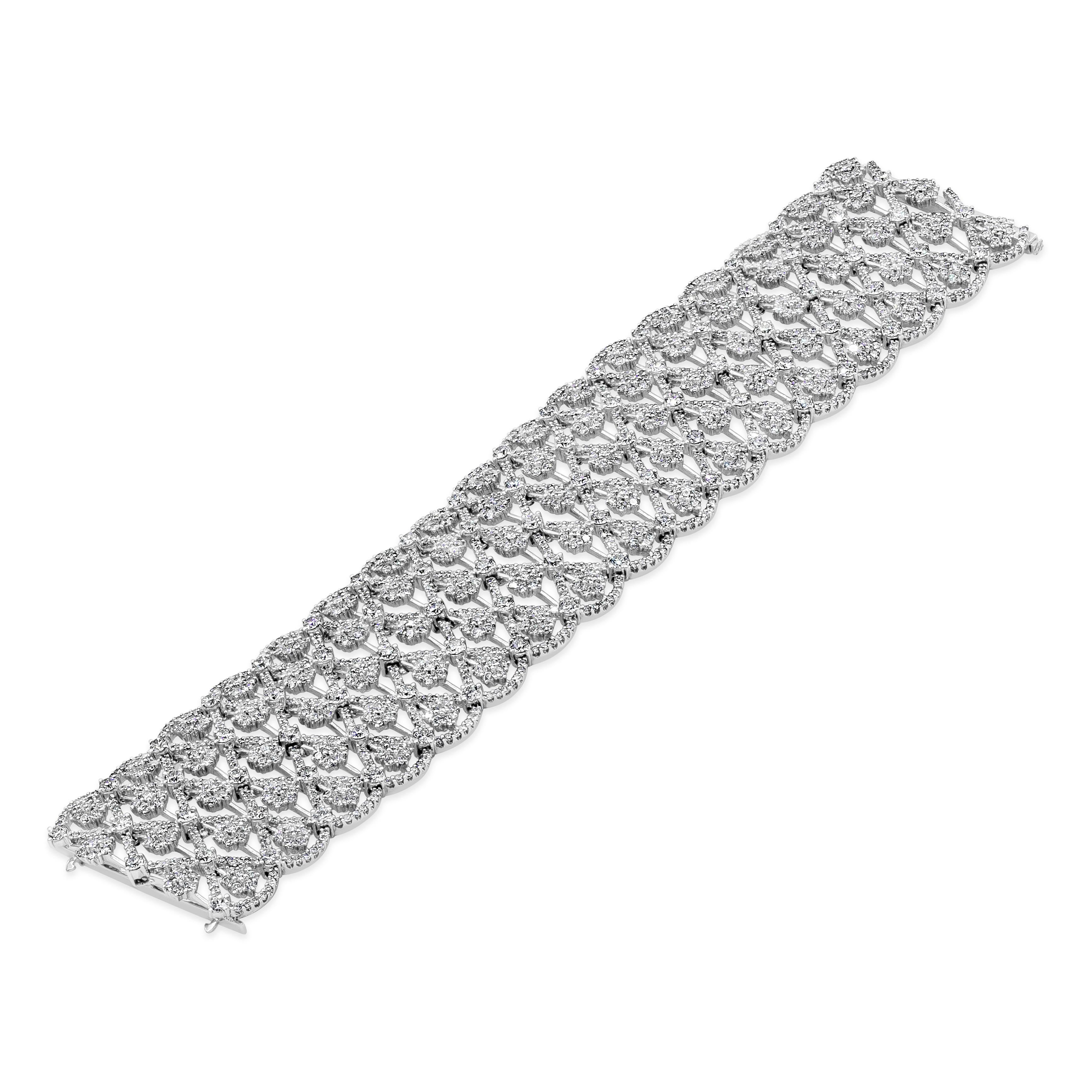 A beautiful and important bracelet showcasing a 28.17 carats of round brilliant diamonds, set in an open-work intricately-designed setting. Made in 18K White Gold and 7 inches in length.

Roman Malakov is a custom house, specializing in creating