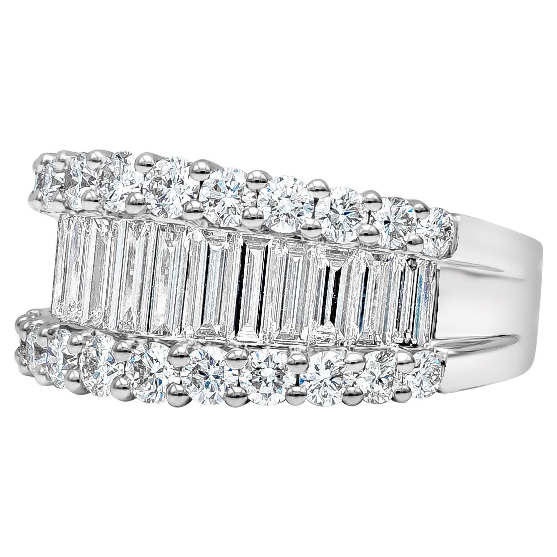 A timeless and fashionable wide ring showcasing 14 baguette diamonds that elegantly graduating in size of approximately 8.20mm-10.75mm, finished with a total of 24 brilliant round diamonds designed as rows on each side of the ring. Baguette diamonds