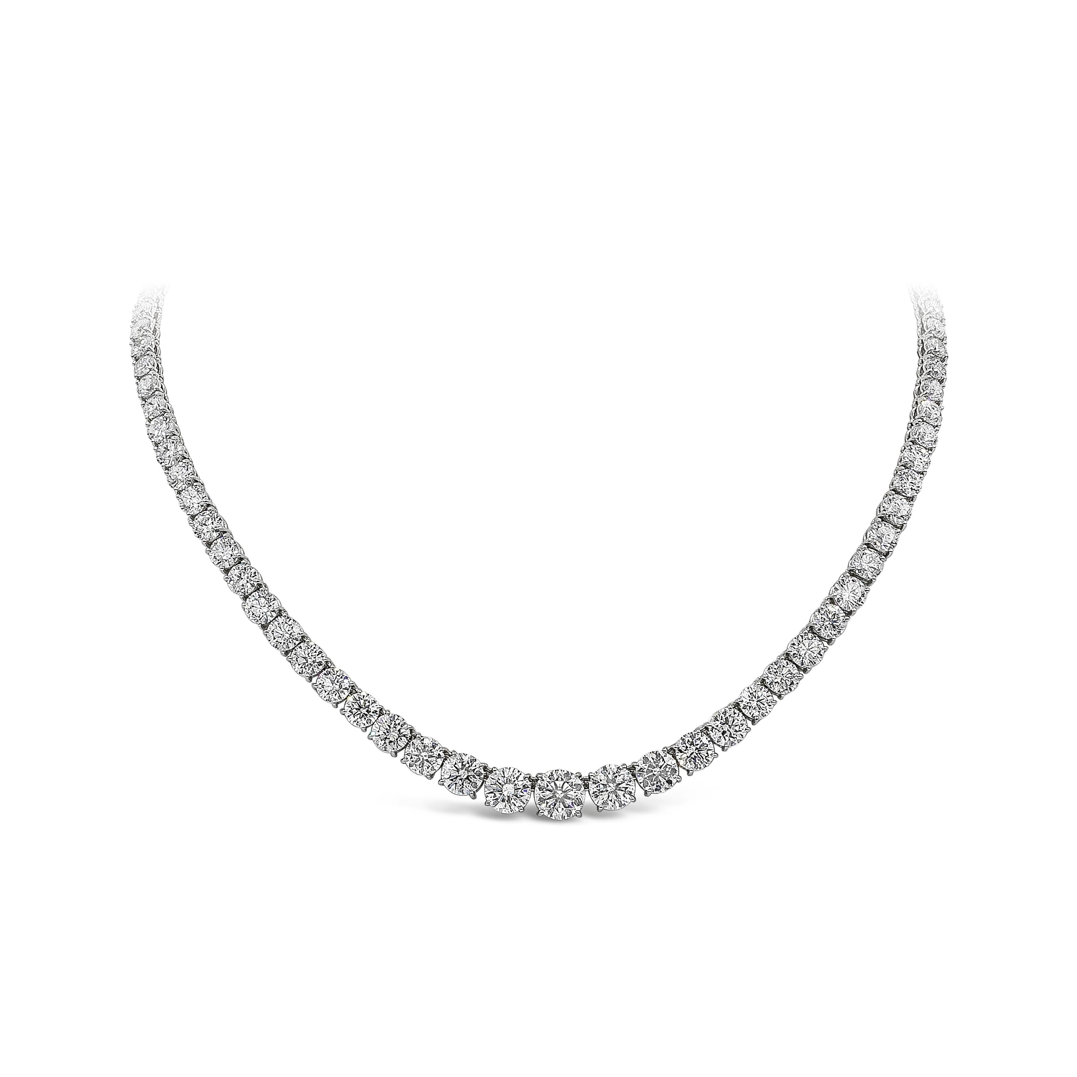 A brilliant and spectacular piece of jewelry showcasing a row of round brilliant diamonds that elegantly graduate in size as it reaches the middle. Diamonds weigh 30.69 carats total and are approximately F color, SI clarity. Finished with a diamond