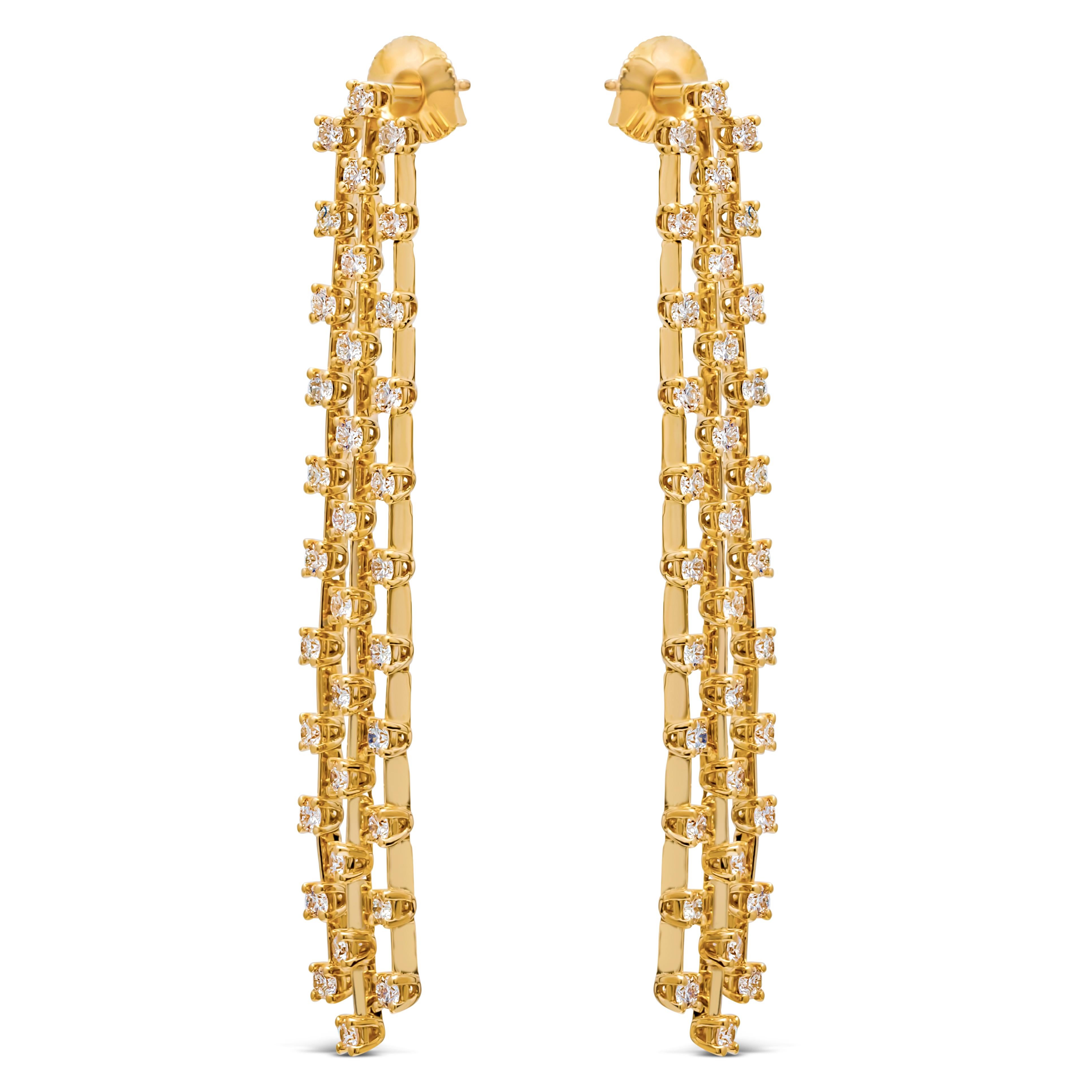 This versatile and stylish chandelier earrings showcasing Three-rows of brilliant round diamonds set in an elegant chandelier waterfall design and classic four prong basket setting. Finely made in 14k yellow gold. Diamonds weigh 3.10 carats total