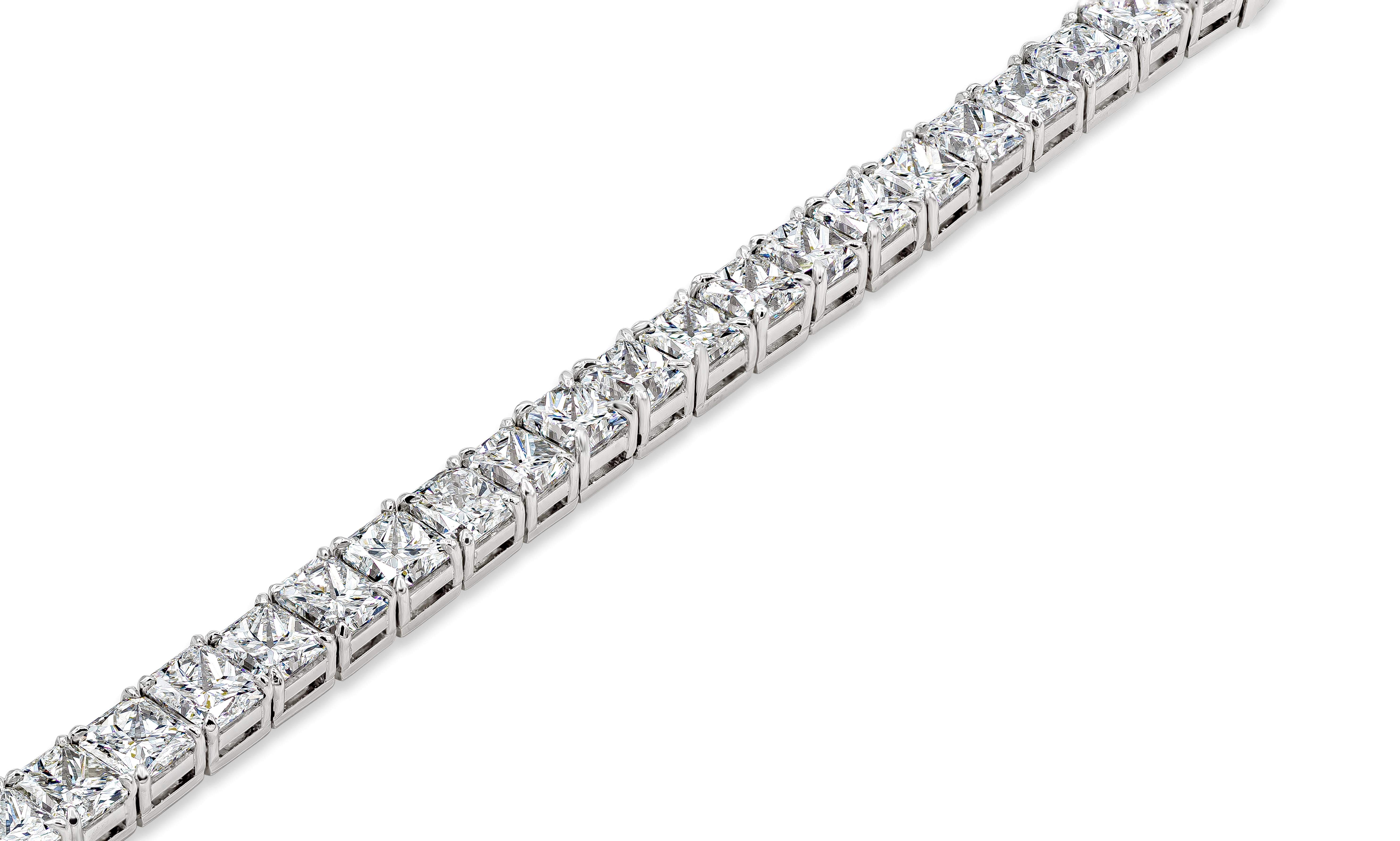 An important and brilliant tennis bracelet showcasing a row of 32 pieces of radiant cut diamonds weighing 31.36 carats total, set in a polished platinum mounting. Diamonds are approximately D-G color and SI in clarity. Perfect addition to anyone's