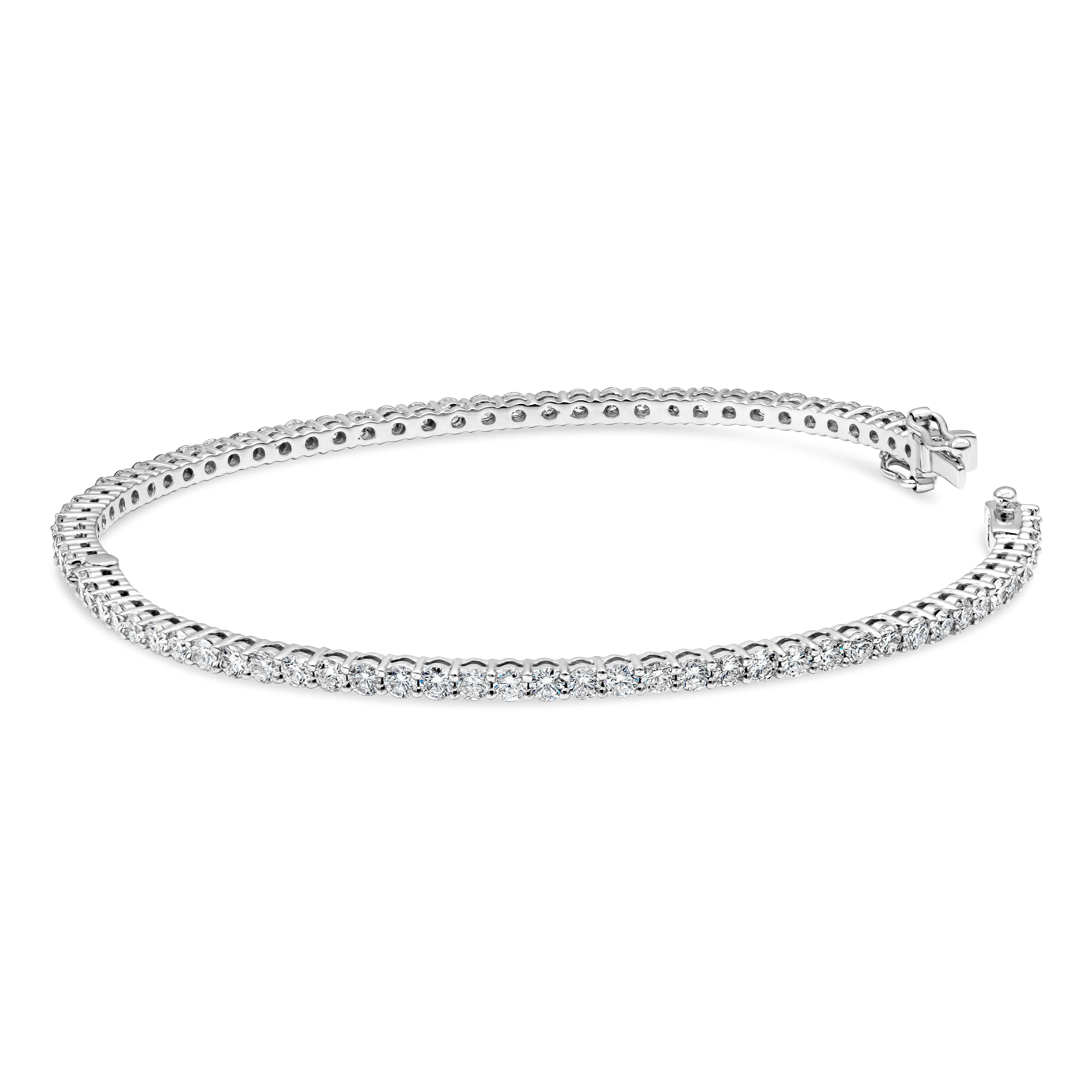 A classic bangle bracelet eternity encrusted with round brilliant diamonds weighing 3.15 carats total. Made with 18K White Gold

Style available in different price ranges. Prices are based on your selection. Please contact us for more information.