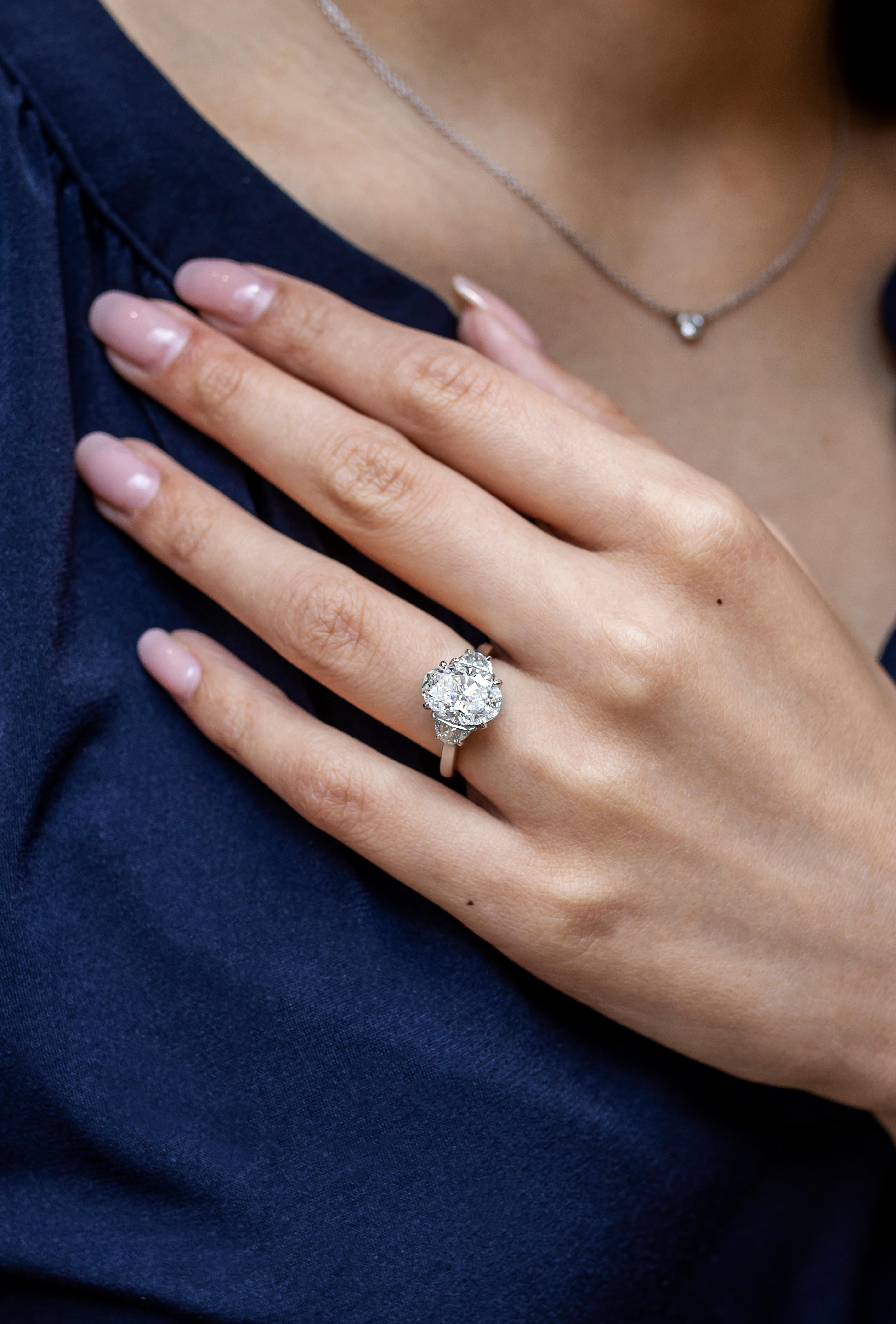 Contemporary Roman Malakov 3.23 Carats Oval Cut Diamond Three Stone Engagement Ring For Sale