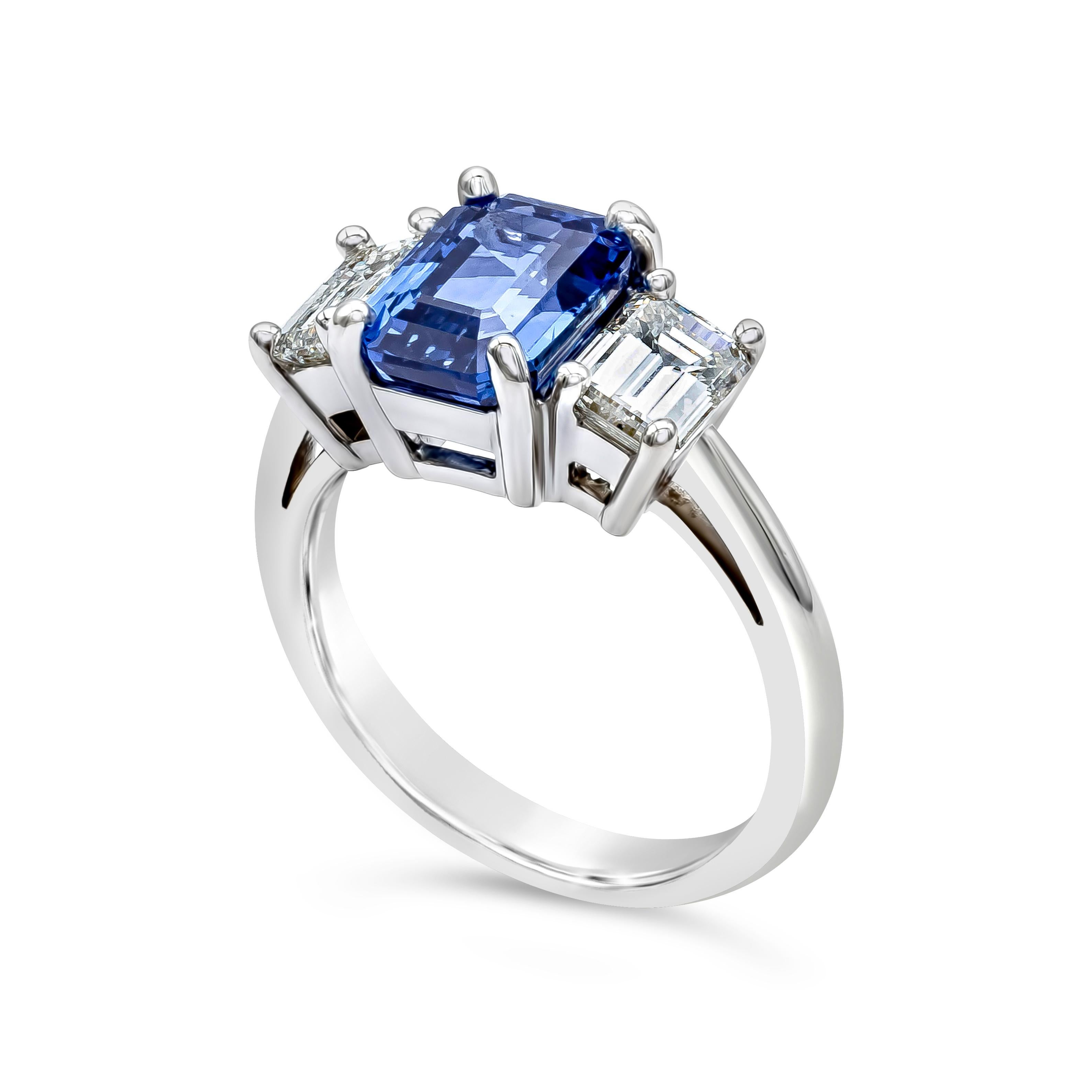 A stunning engagement ring that features a GIA Certified emerald cut blue sapphire weighing 3.25 carats, flanked by two emerald cut diamonds weighing 1.23 carats total, G-H Color and VS in Clarity. Made with Platinum. Size 6.5 US

Roman Malakov is a