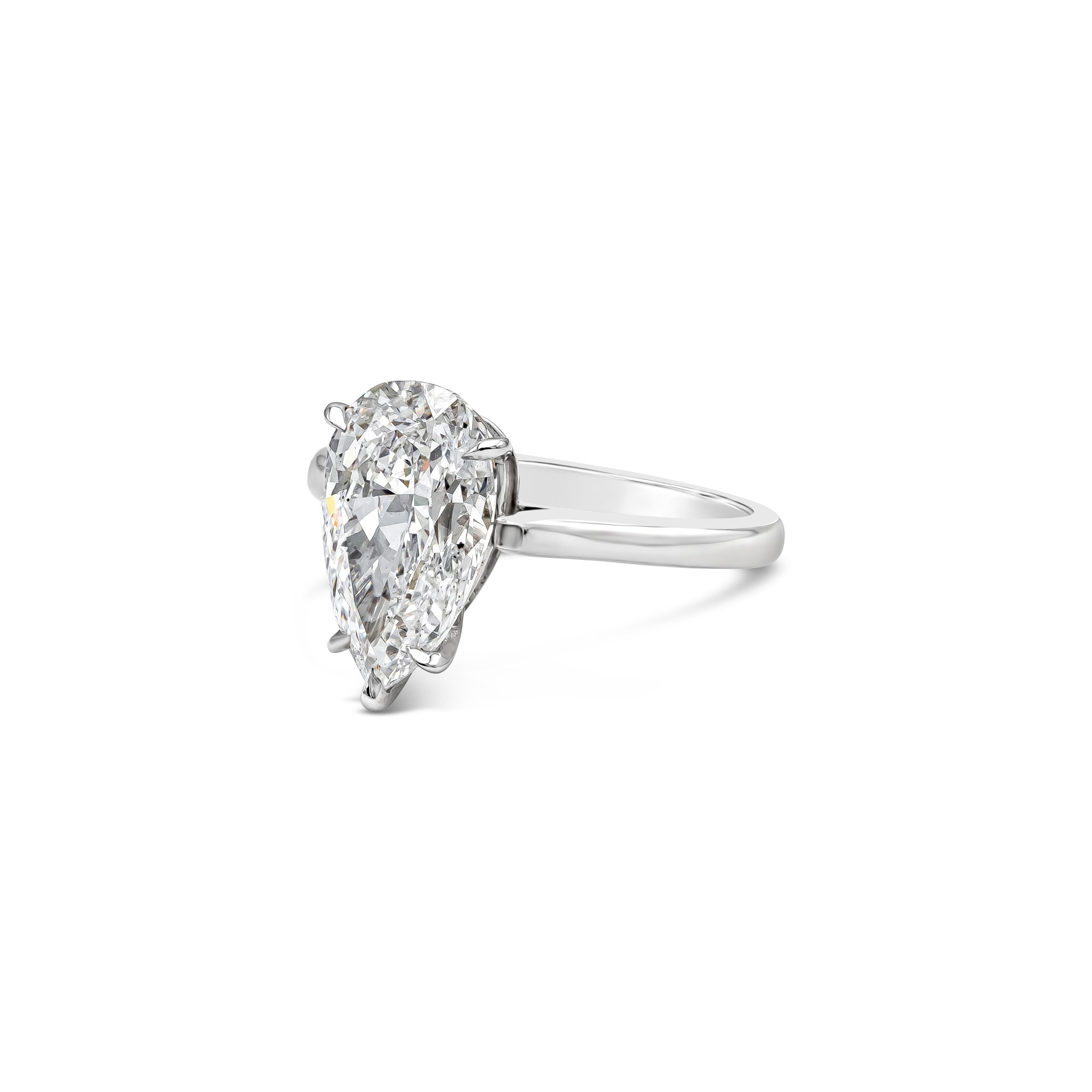 This simple and elegant solitaire engagement ring features a 3.27 carats total pear shape diamond certified by GIA as D color, SI2 in clarity. Set in a platinum five prong setting. Finely made in platinum. Size 6 US resizable upon request.

Style