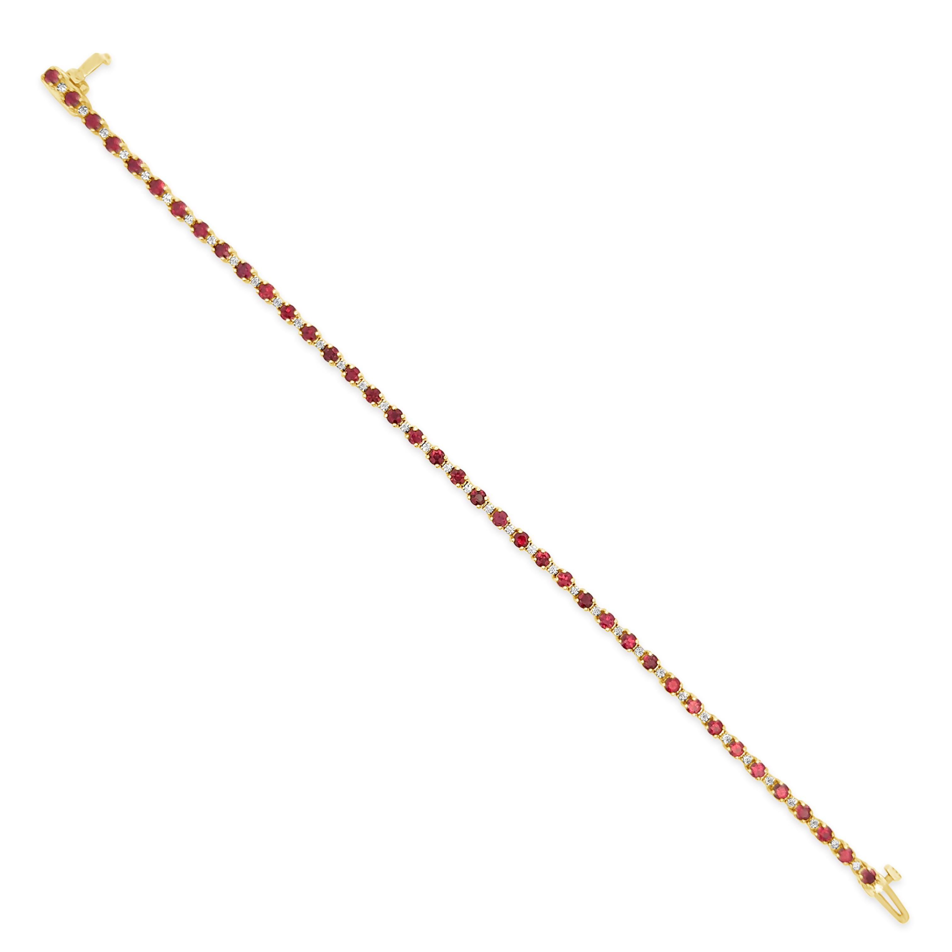 A fashionable tennis bracelet, featuring round cut red rubies weighing 3.15 carats total and smaller round cut diamonds weighing 0.37 carat total, set in alternating fashion. Finely made with 14K yellow gold, 7 inches in length. Perfect accessory to