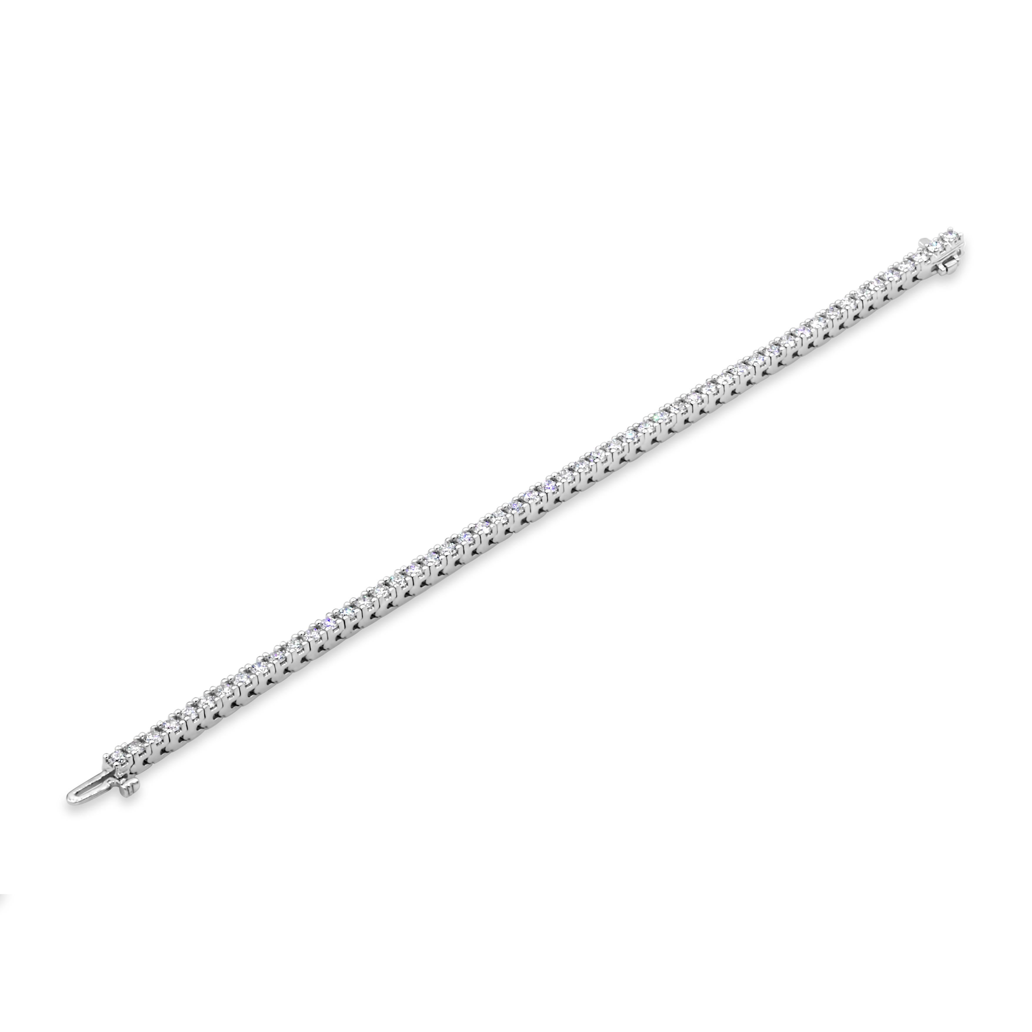 A classic tennis bracelet style showcasing a row of brilliant round diamonds weighing 3.58 carats total, G Color and SI in Clarity. Set in a four-prong basket setting. Made in 14K White Gold and 7 inches in Length. 

Roman Malakov is a custom house,