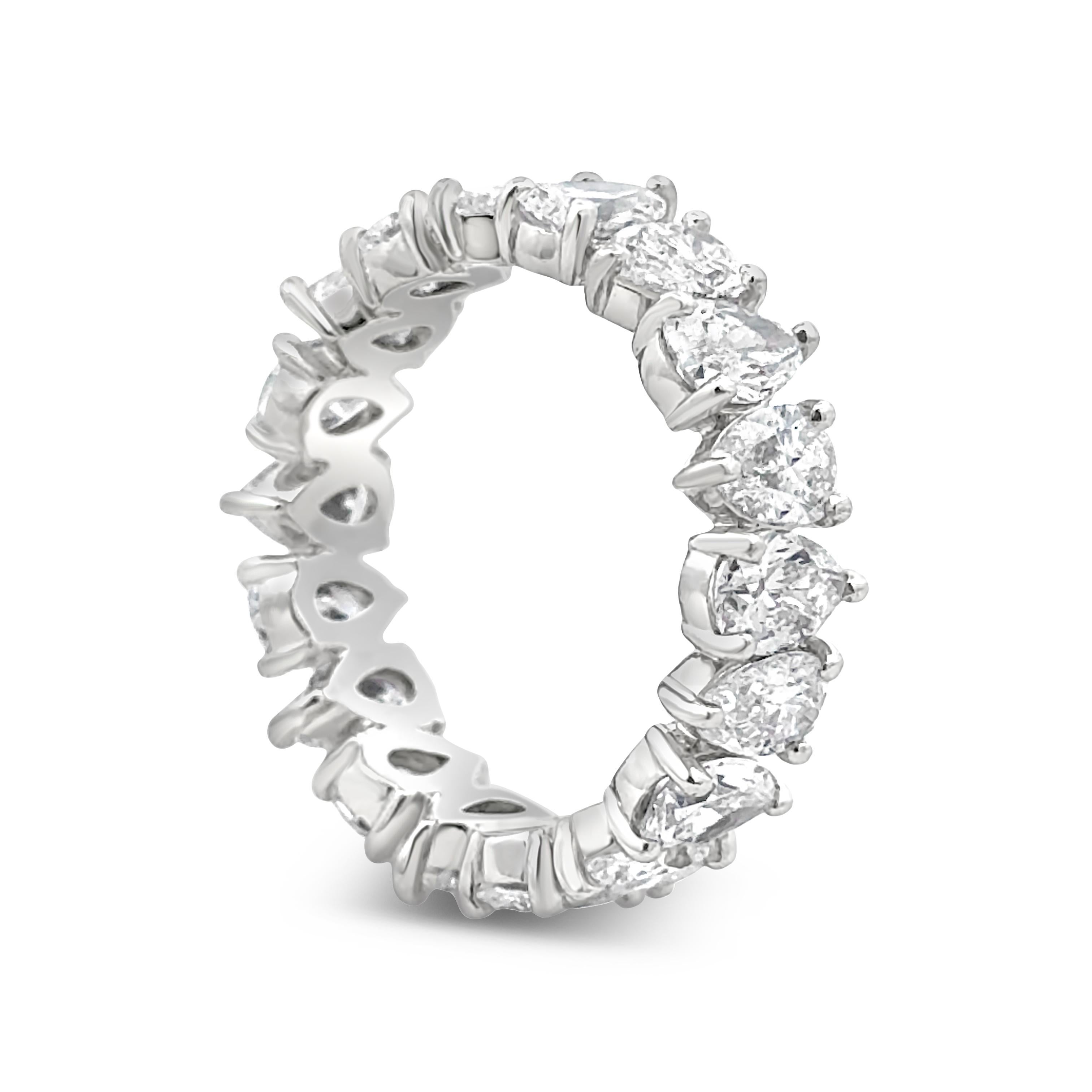 A beautiful eternity wedding band ring, featuring 18 pear shape diamonds weighing 3.77 carats total with E-F color and VS-SI1 clarity, set in an alternating inverted design. Finely made with a platinum mounting. Size 4.75 US, resizable upon request.