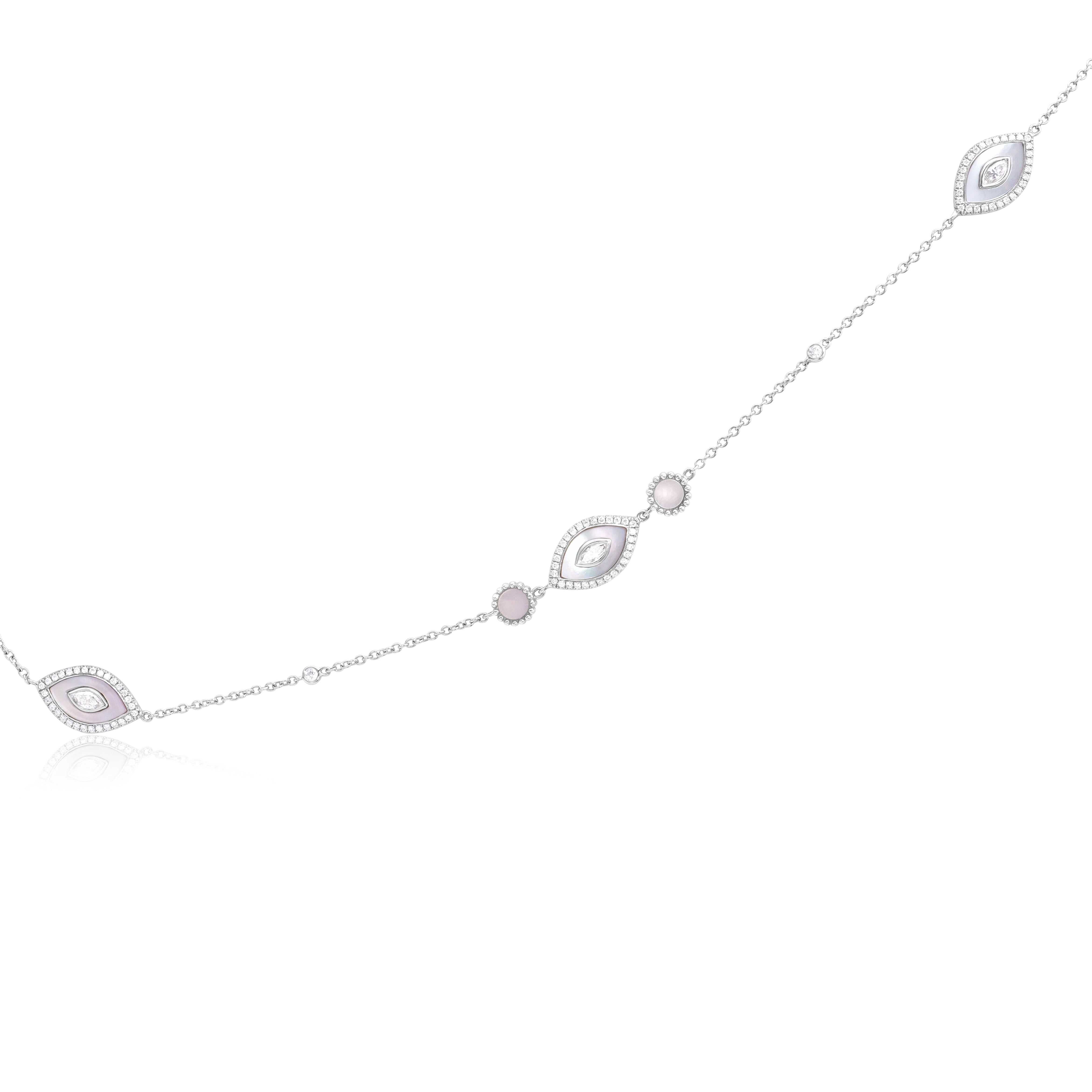 A stylish long necklace, featuring marquise cut diamonds, bezel-set with a mother of pearl design. Surrounded by a halo of round cut diamonds, set with a pavé setting. Chain is accented by a diamonds by the yard style. Diamonds weigh 3.78 carats