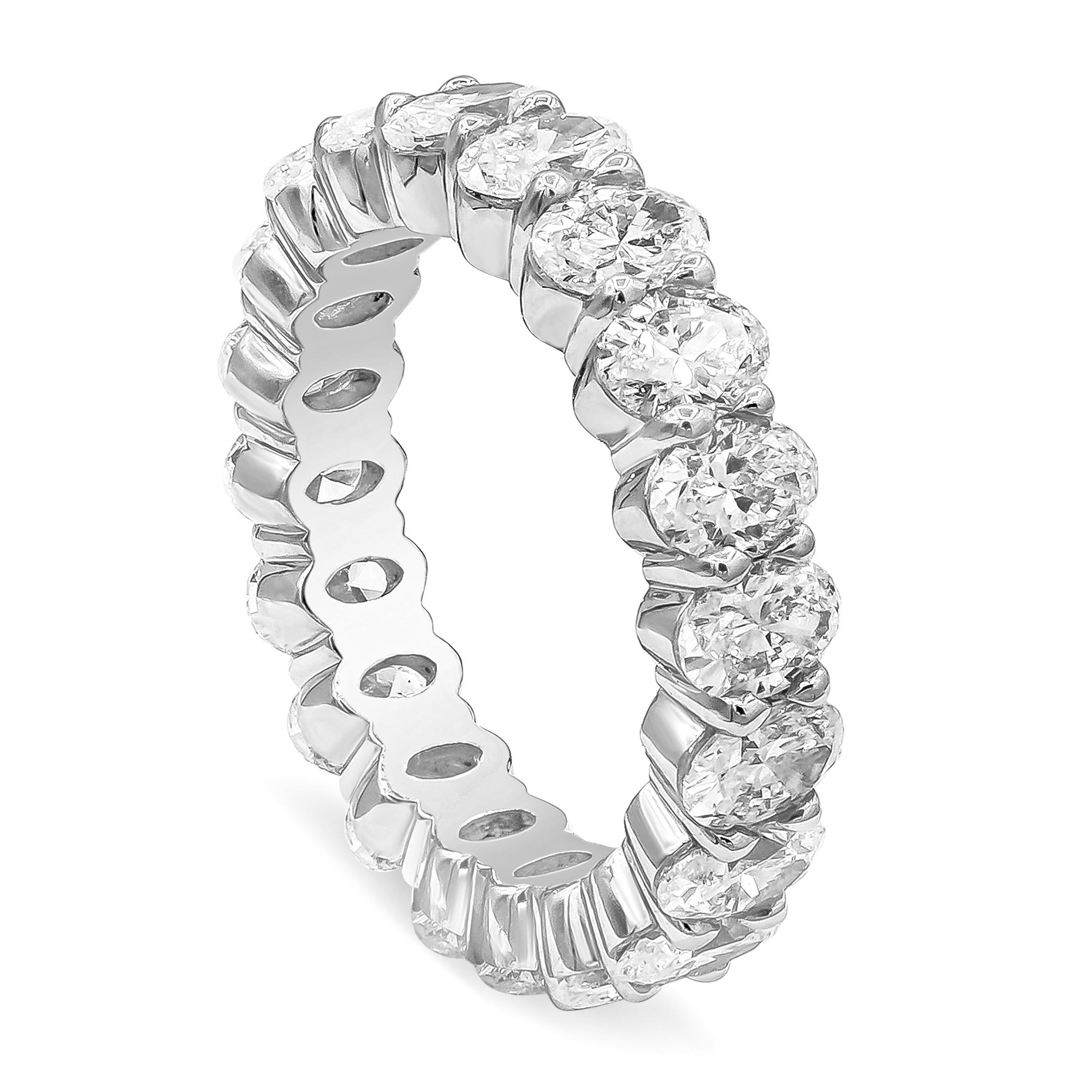 A brilliant eternity wedding band showcasing oval cut diamonds, weighing 7.50 carats total, G-H Color and VS-SI in Clarity. Made with Platinum, Size 6.25 US.

Roman Malakov is a custom house, specializing in creating anything you can imagine. If you