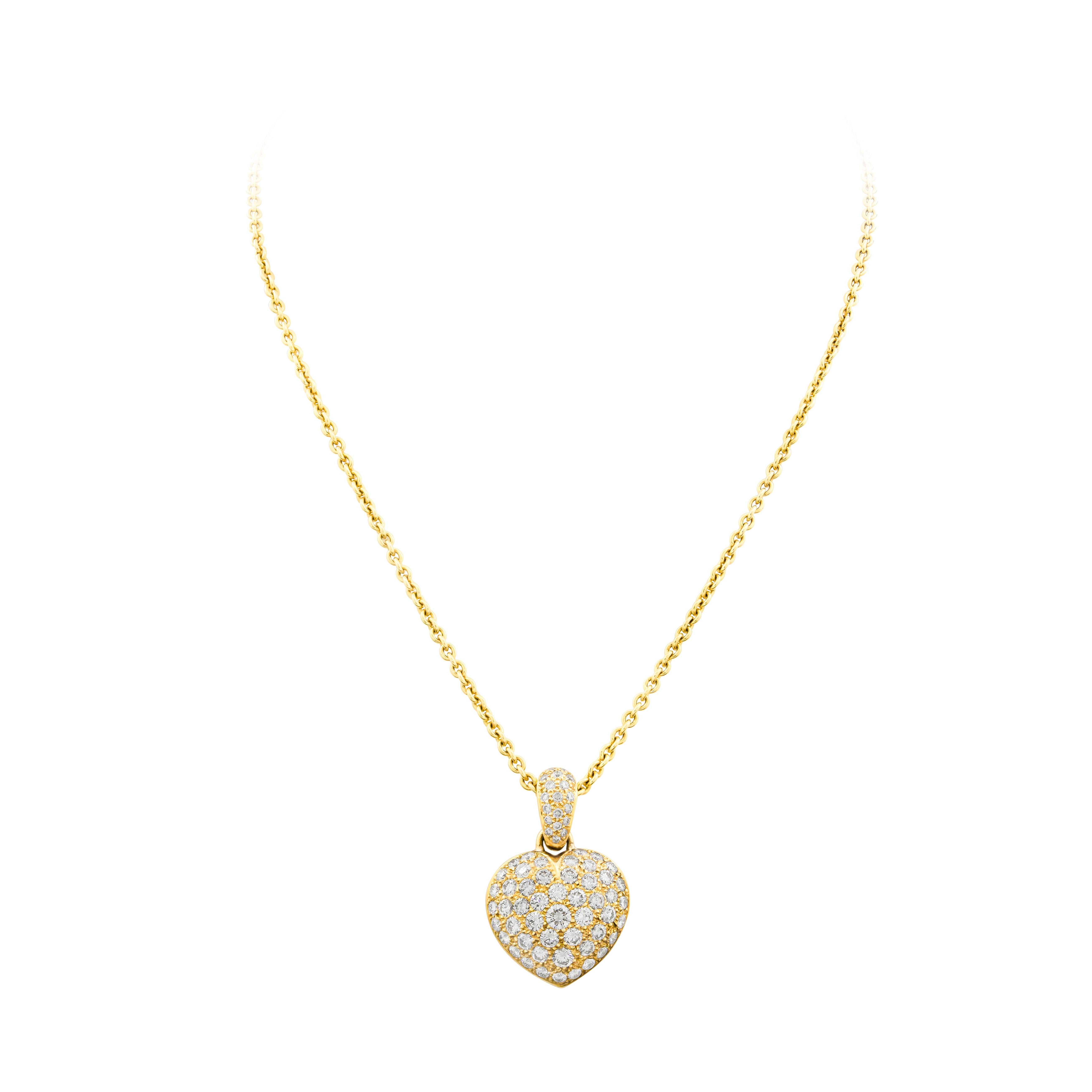 Showcases a rounded heart shaped pendant micro-pavé set with sparkling round diamonds. The diamonds graduate in size as it reaches the center of the heart. Diamonds weigh 4.43 carats total. The pendant is suspended on a diamond encrusted bale made