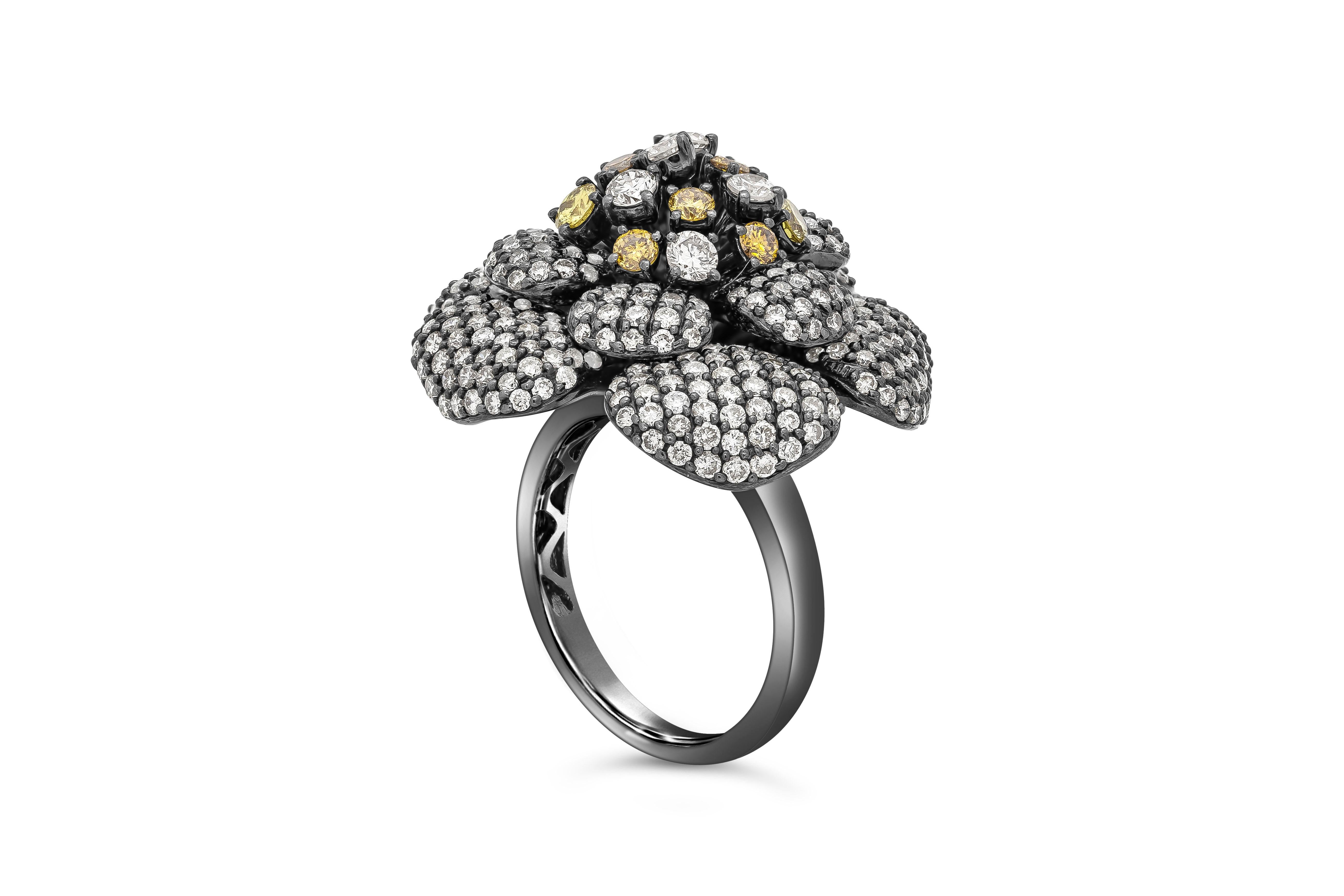 A unique fashion ring showcasing a cluster of fancy colored round diamonds accented with white round diamonds set in a petal leaf like design. Diamonds weigh 4.53 carats total. Made in 18K Gold in Black Rhodium.

Roman Malakov is a custom house,