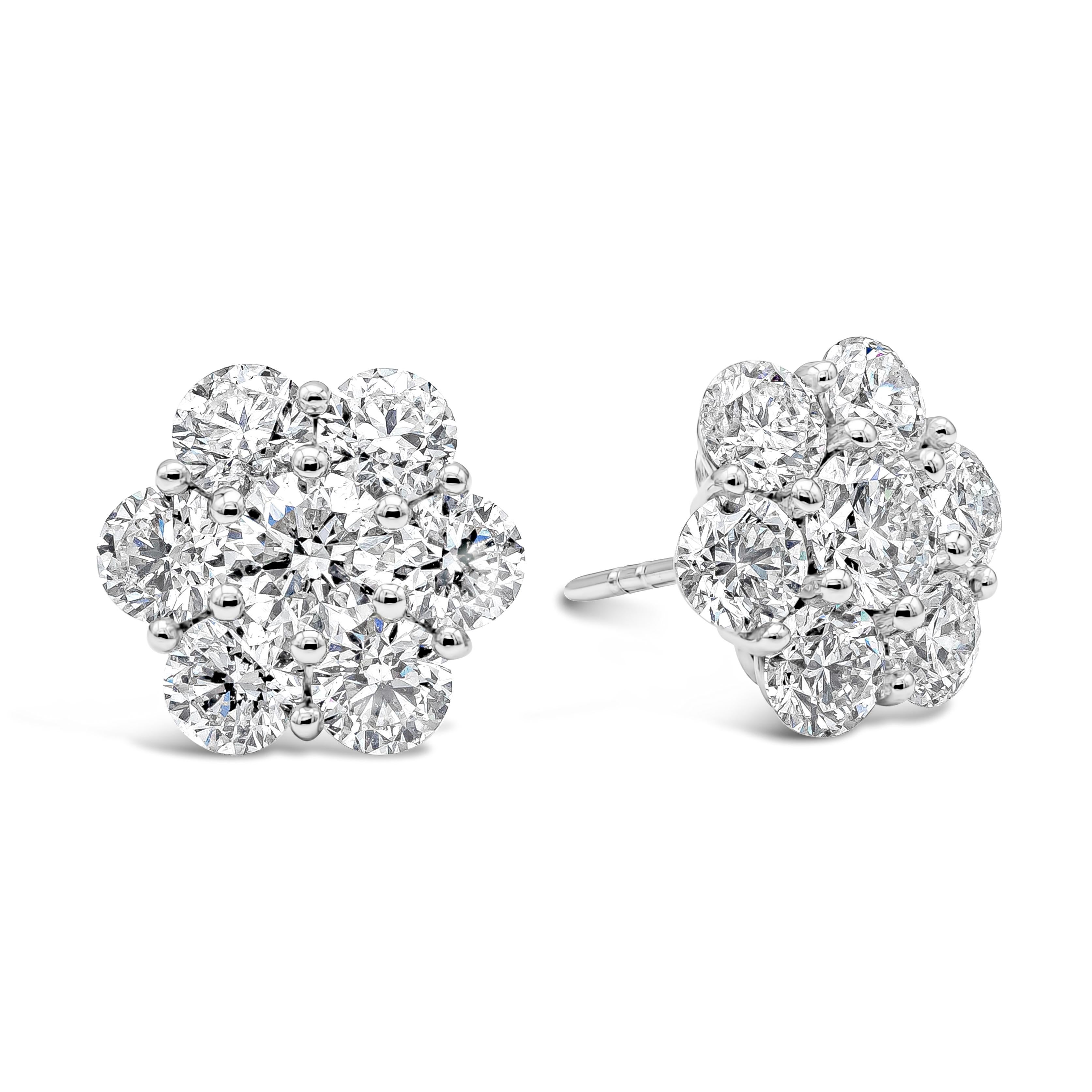 A simple and chic pair of stud earrings showcasing a cluster of round brilliant diamonds, arranged in a floral-motif design. Center diamond is 4.50mm in diameter and the accents are 4.10mm in diameter. Diamonds weigh 4.66 carats total and are