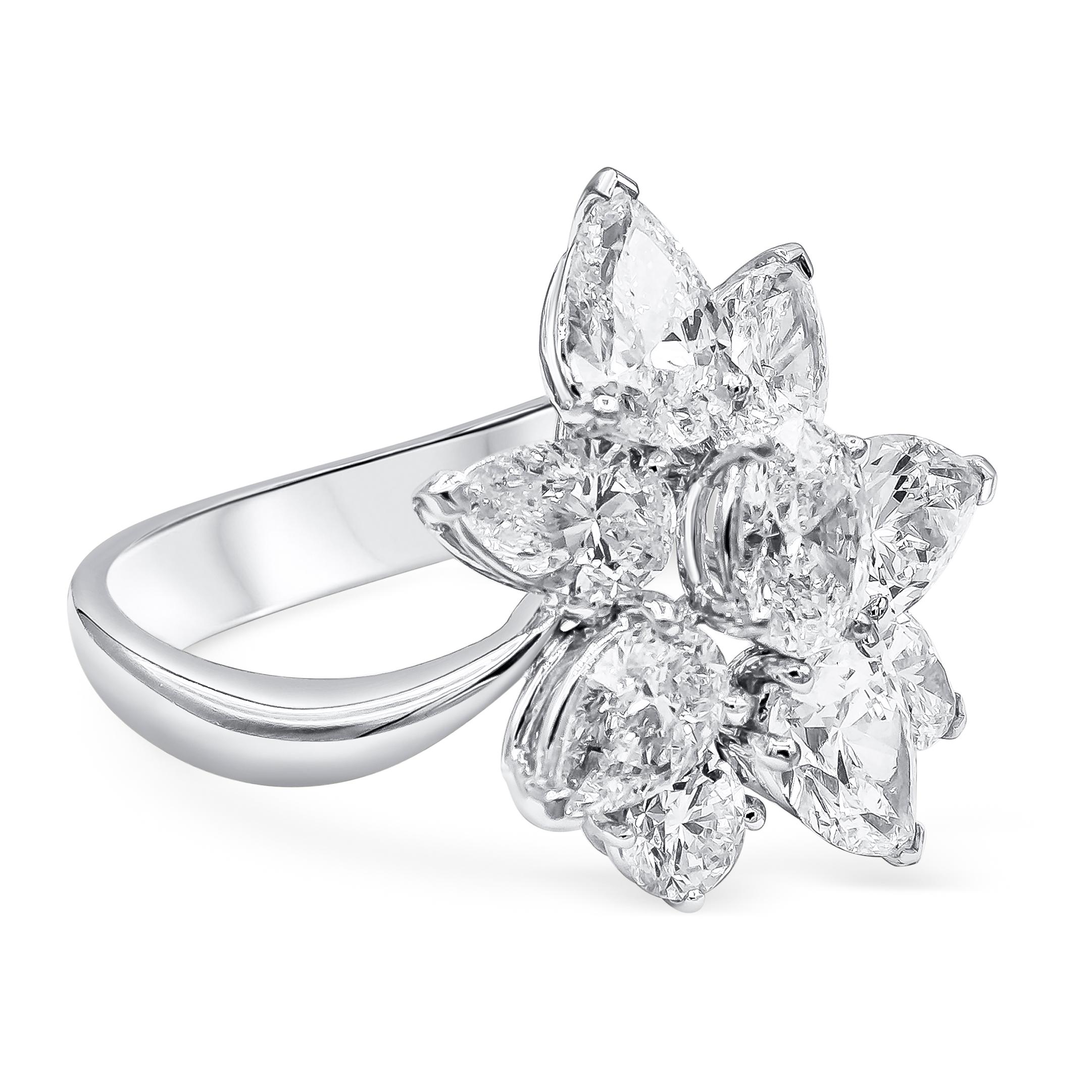A beautiful fashion ring showcasing a cluster of mix cut diamonds weighing 4.66 carats total, D-F color and VS-SI1 in clarity. Set in a floral-motif design. Set and mounted on a curved band made in 18K White Gold. Size 6 US resizable upon
